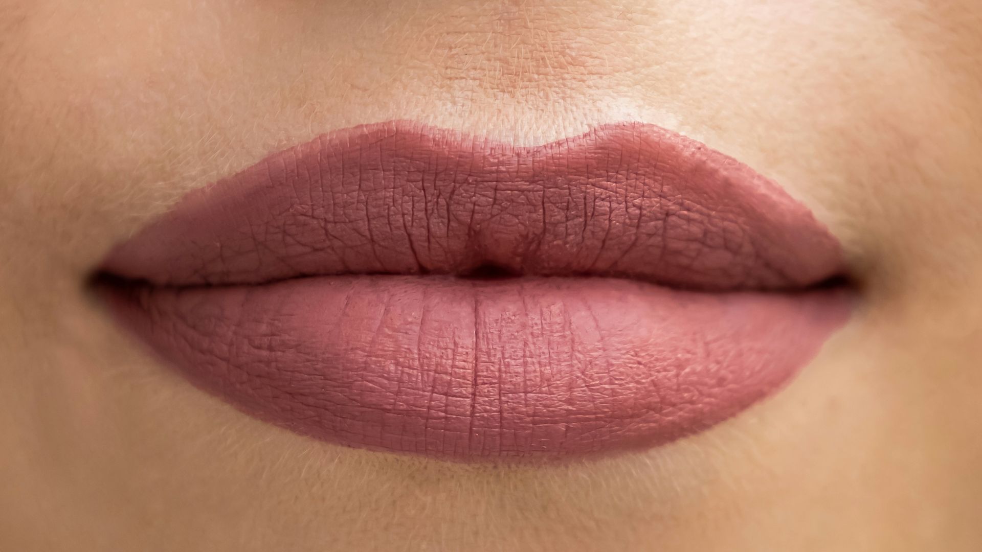 a close up of a woman's lips and nose