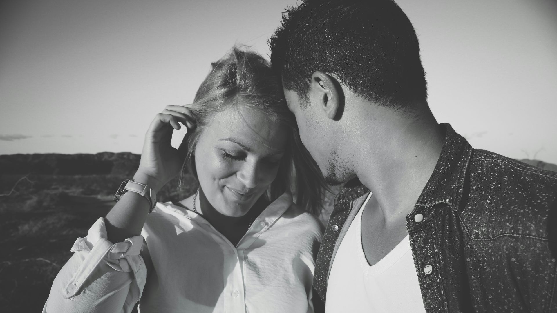 grayscale photography of man and woman