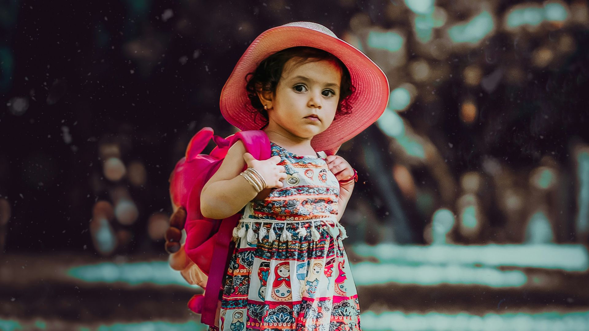 toddler carrying backpack