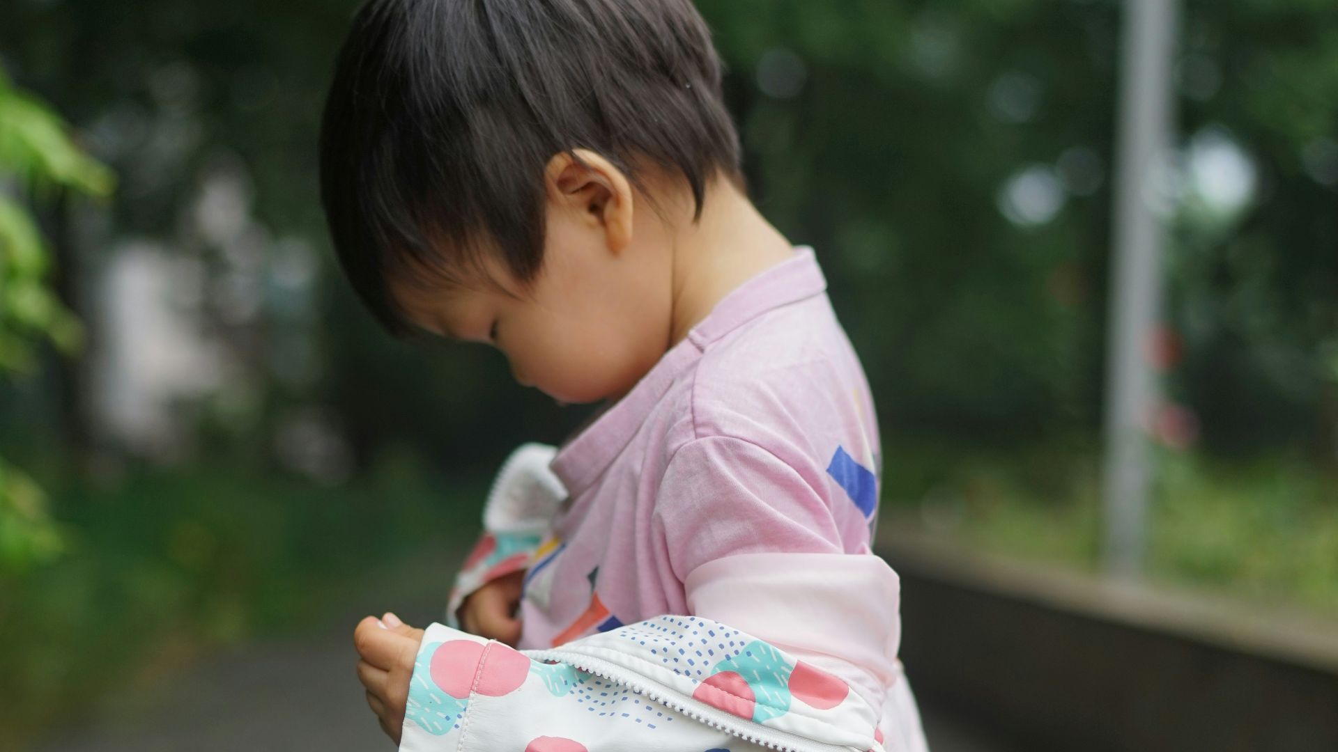 A child wearing a colorful kimono.
