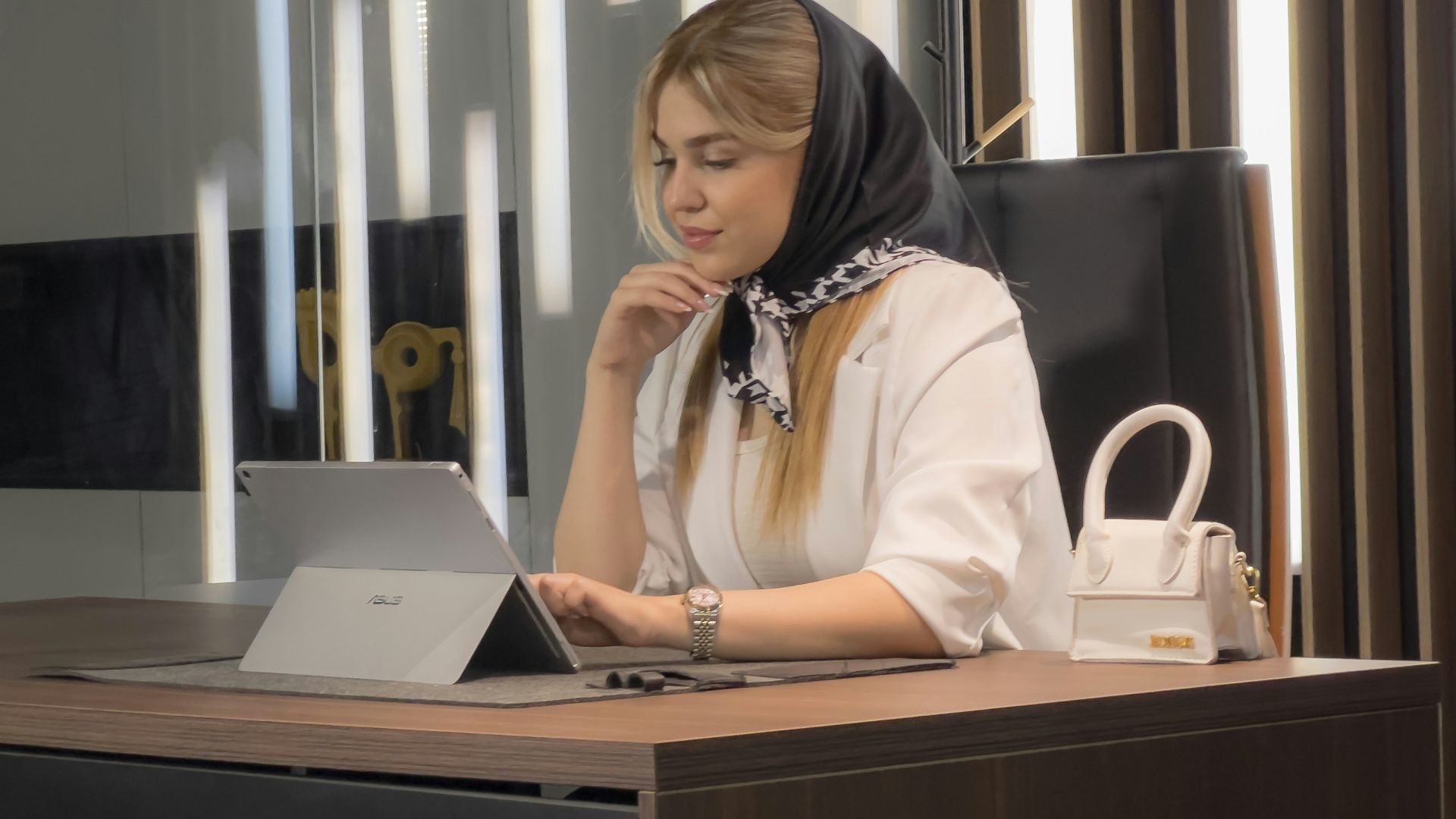a woman sitting at a desk