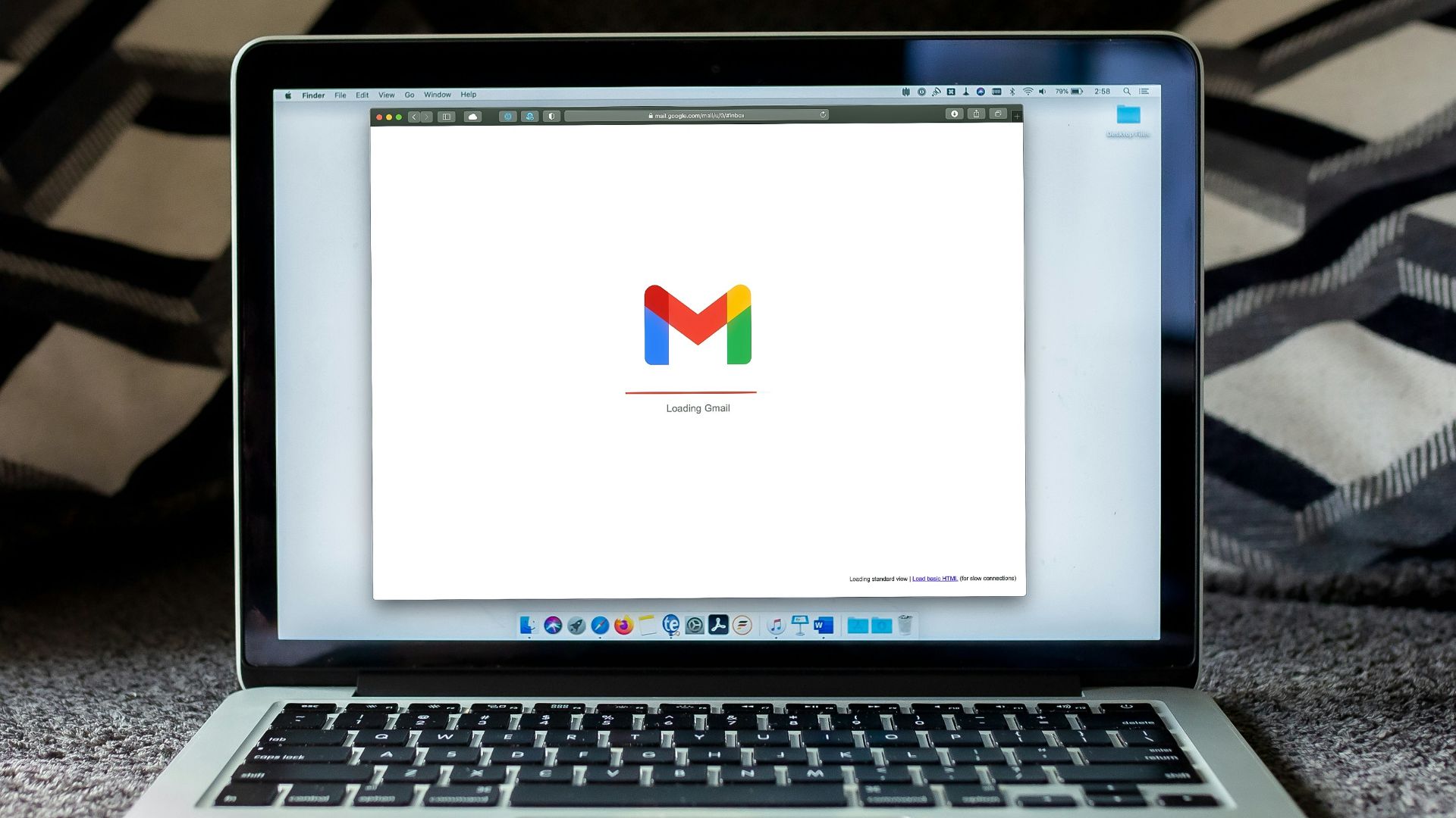 macbook pro on black textile