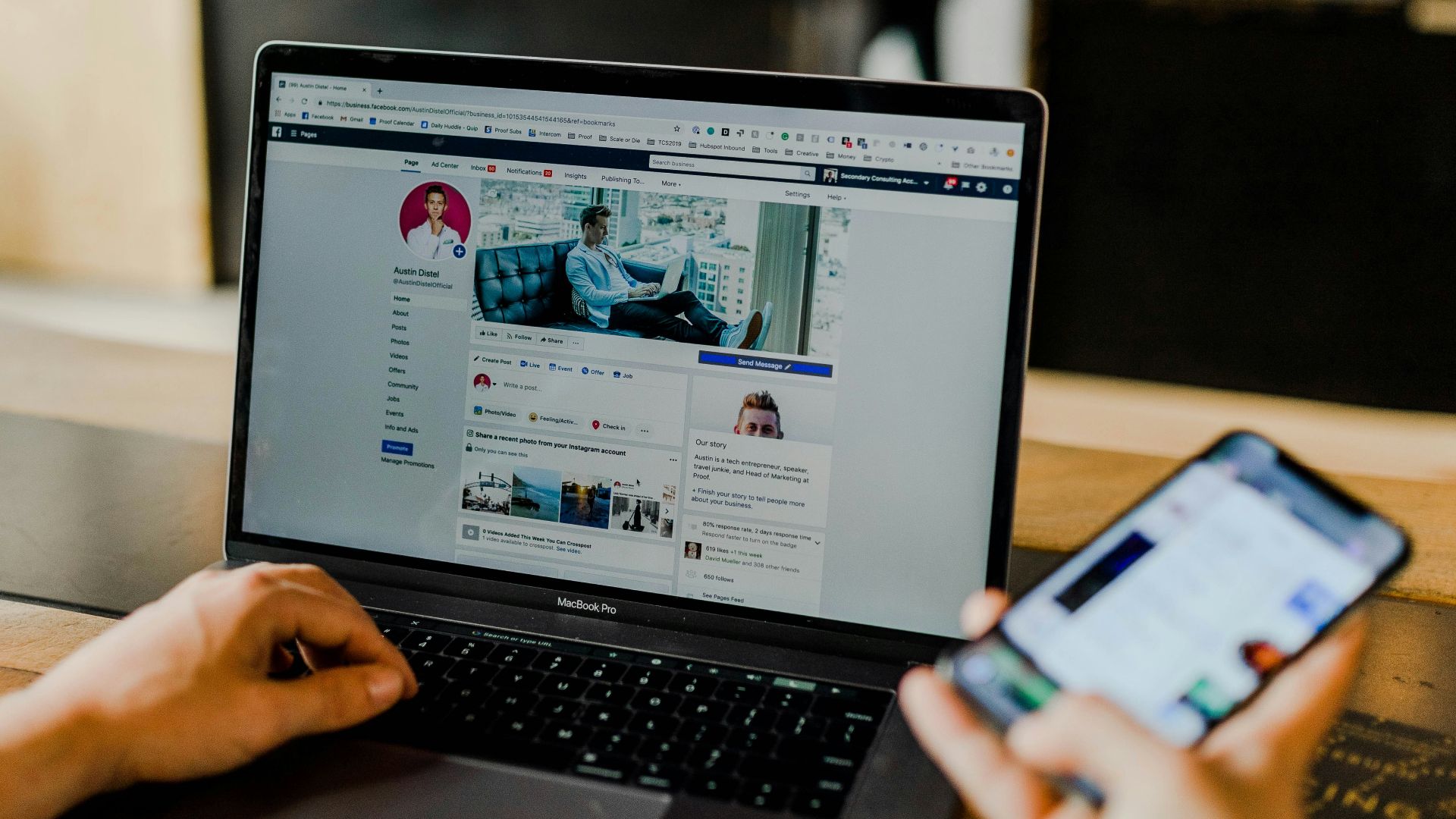 person using both laptop and smartphone