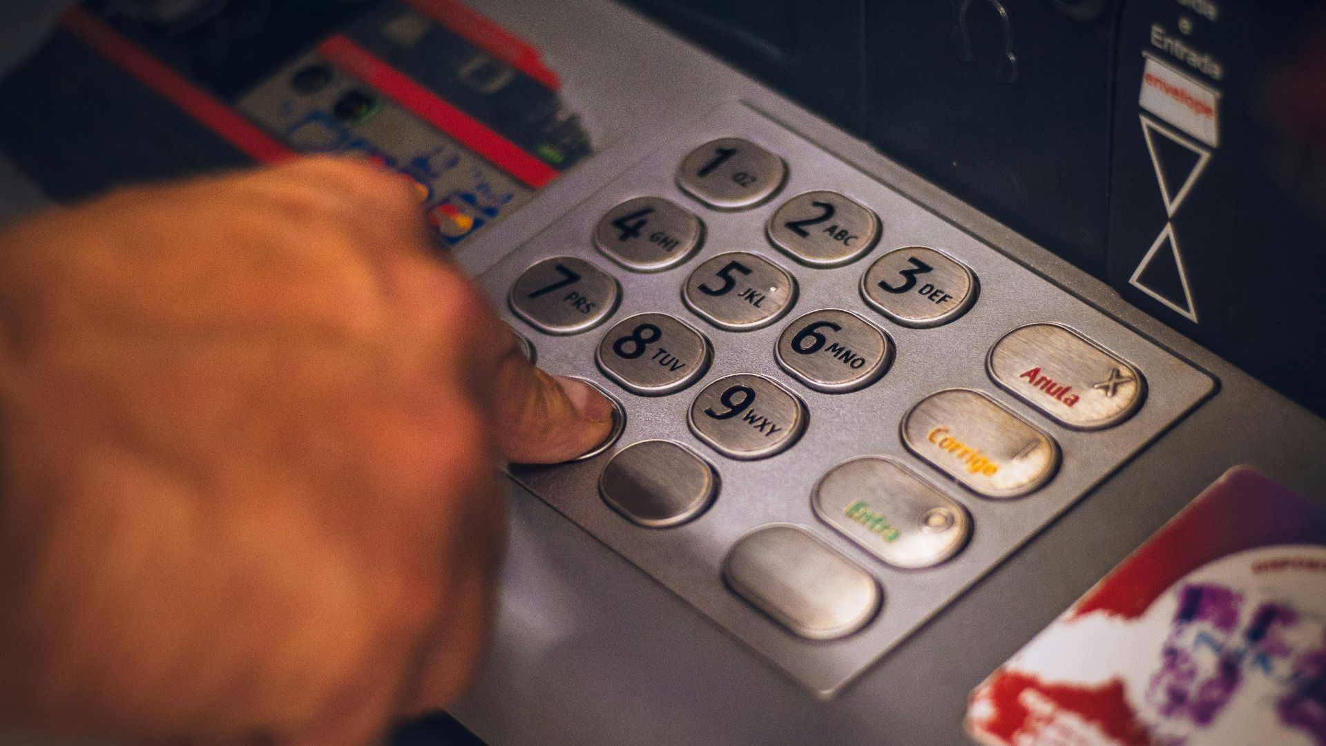 person holding white and red card