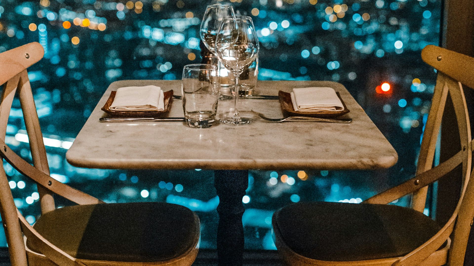 white ceramic table and chairs with glassware