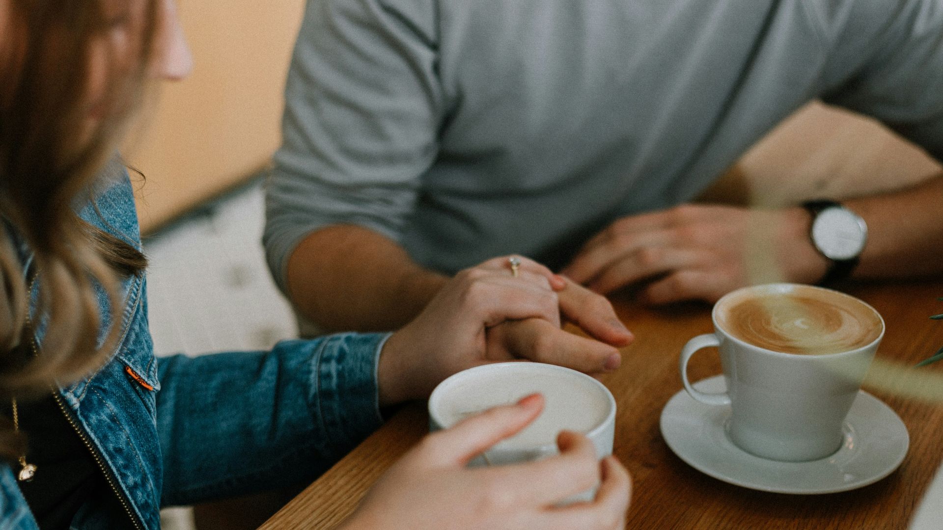 two mugs with coffee on table