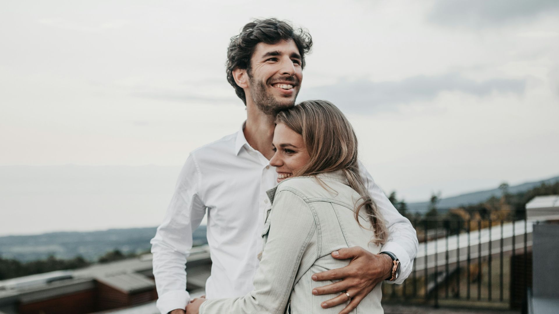 man and woman hugging each other