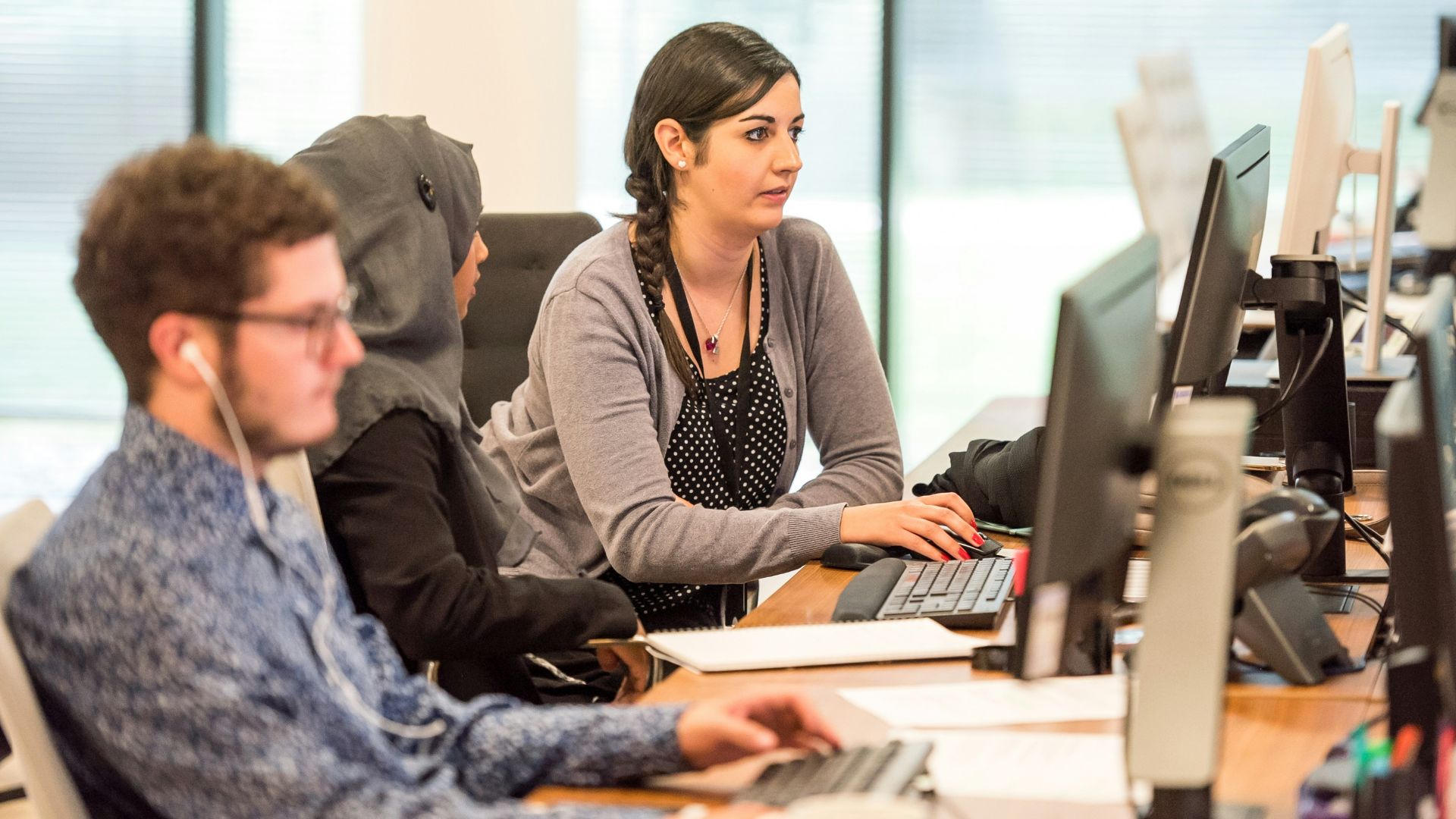 unknown persons using computer indoors