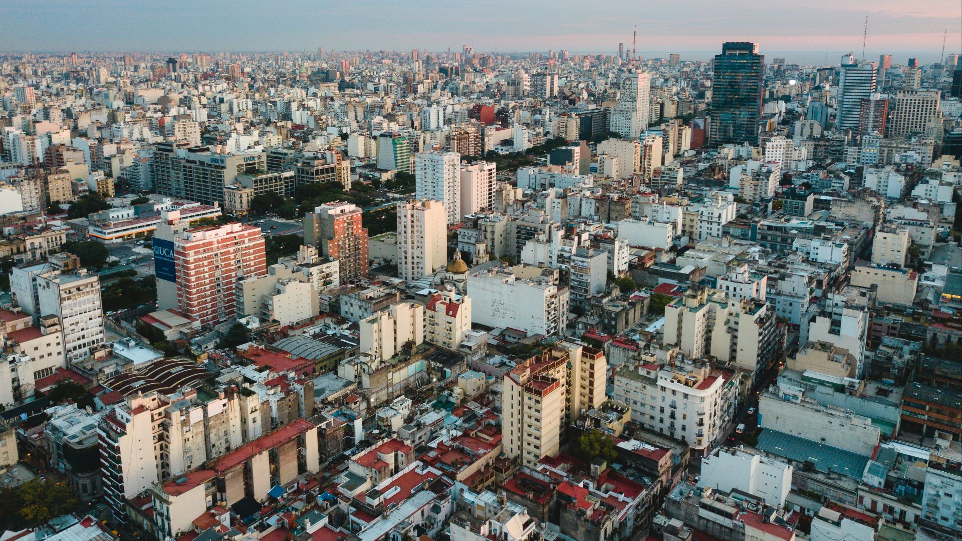 aerial view of city under cloudy sky during daytime