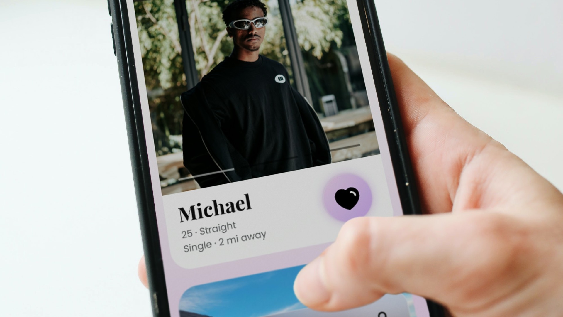 a person holding a cell phone with a picture of a man on it