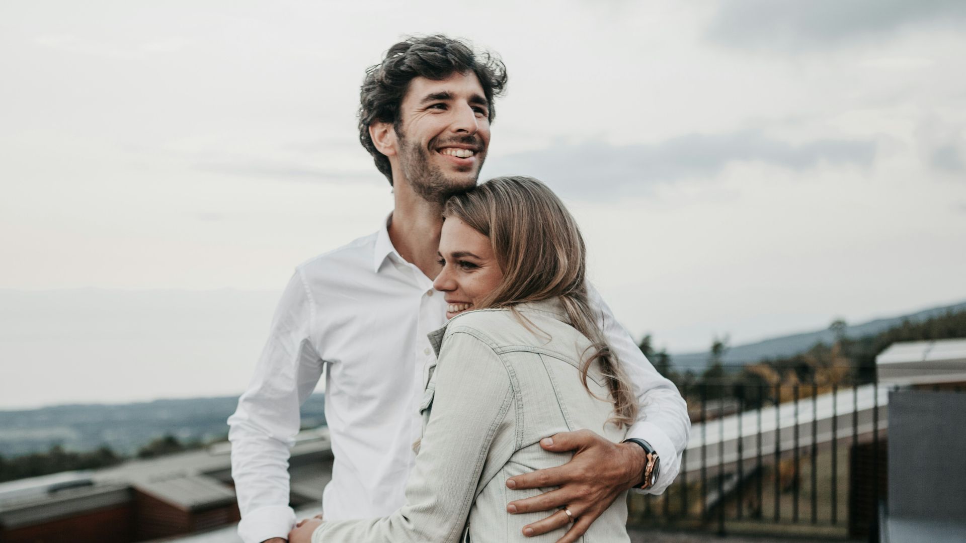 man and woman hugging each other
