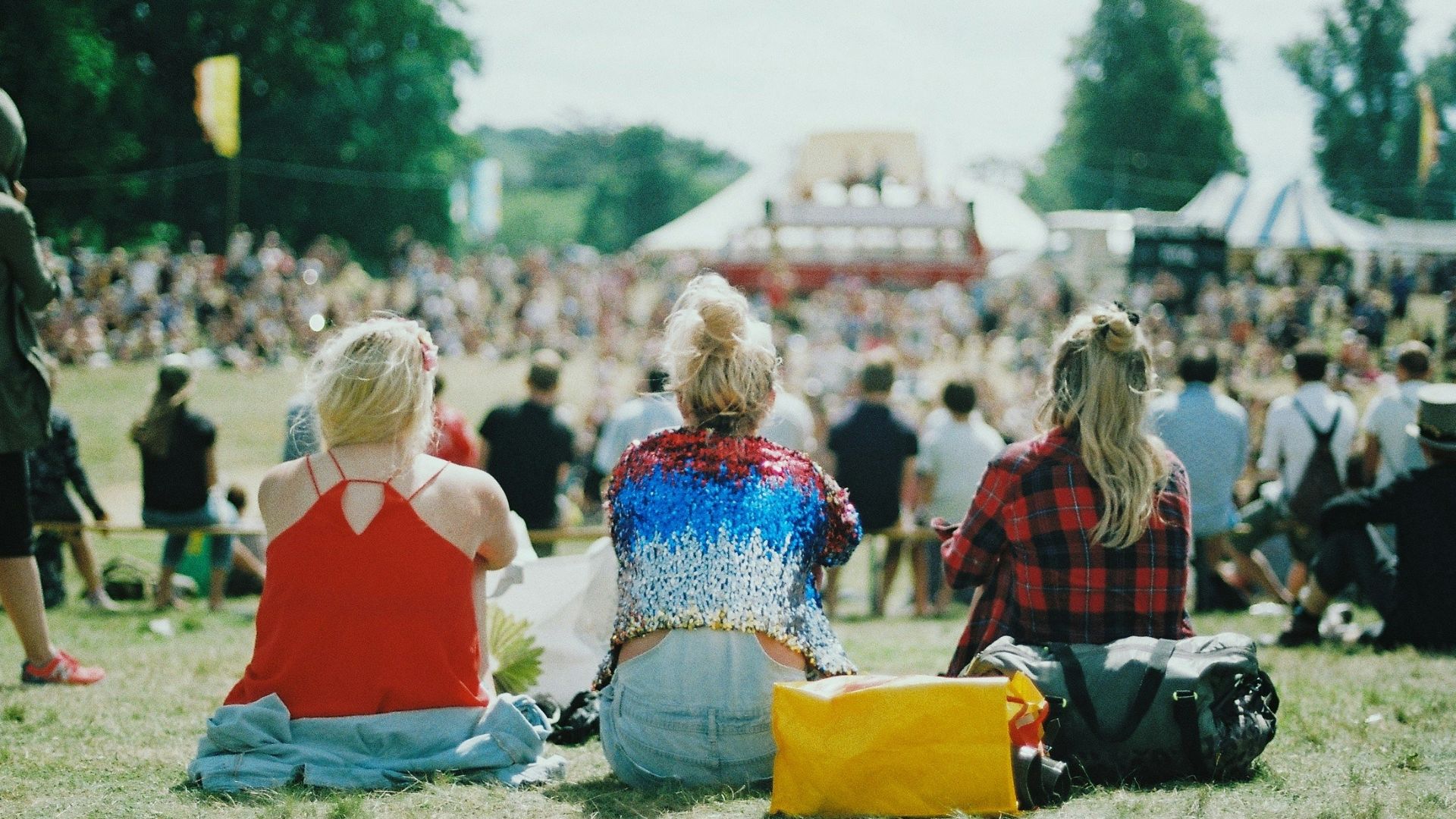 group of people on grass field under sunny day