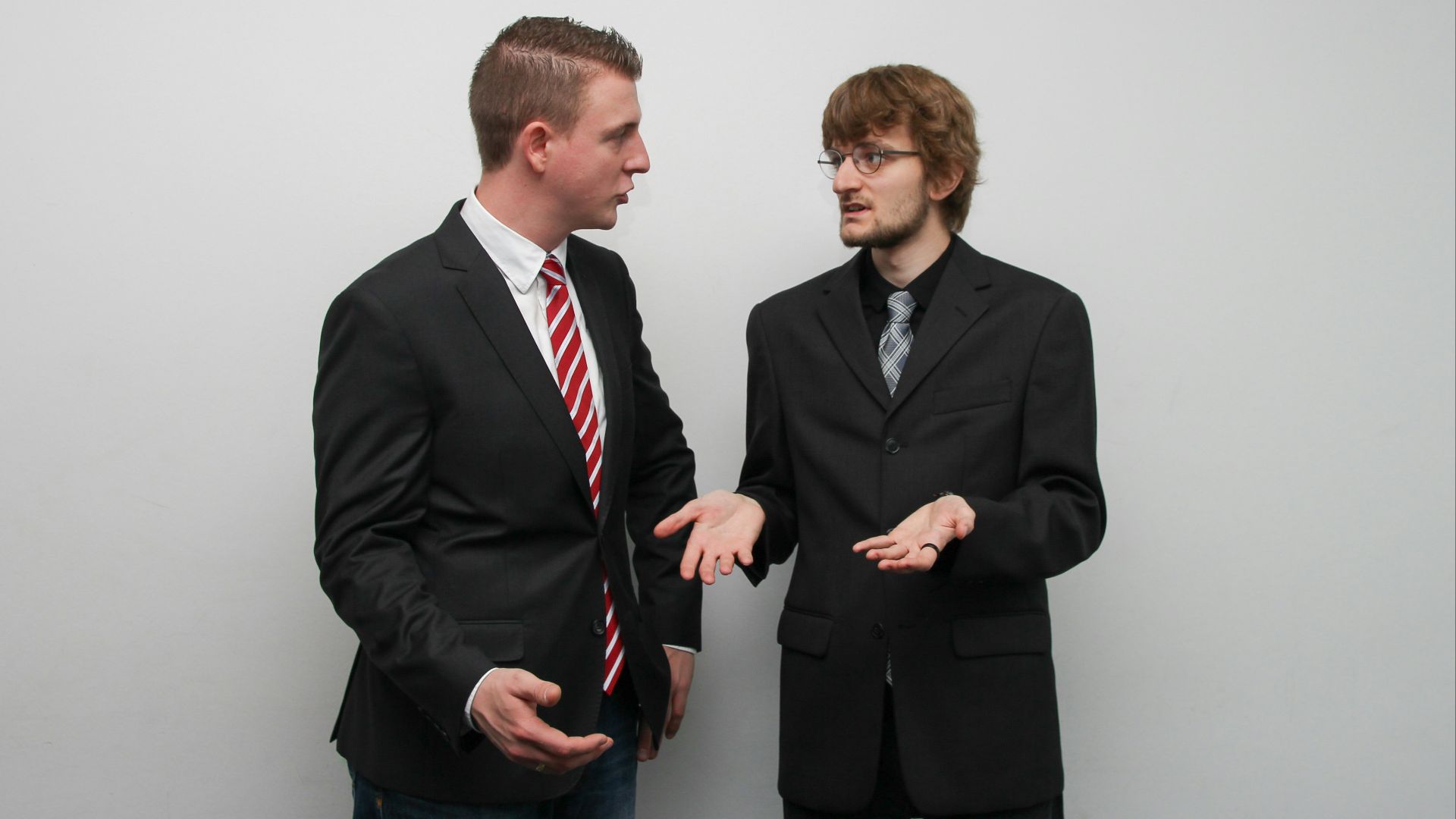 man wearing black suit jacket