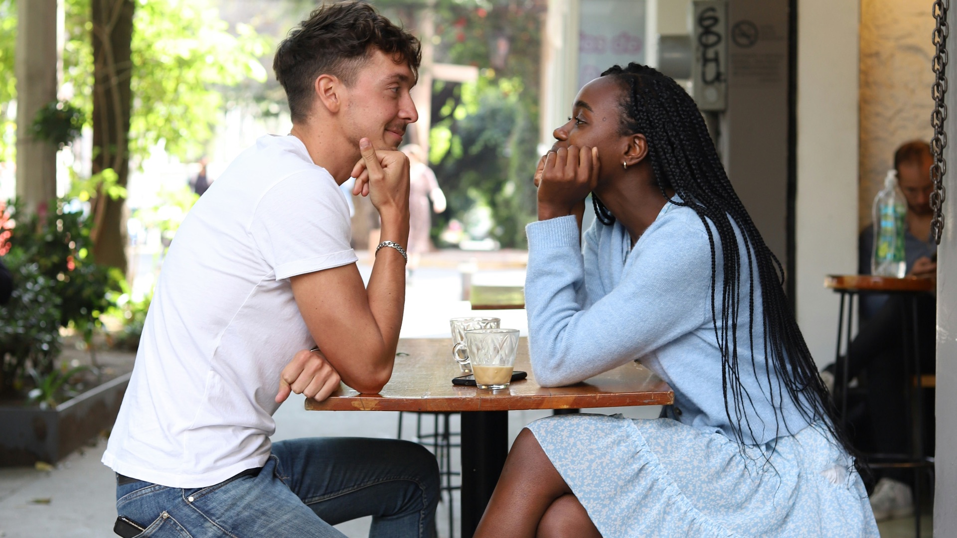 a man and a woman sitting at a table