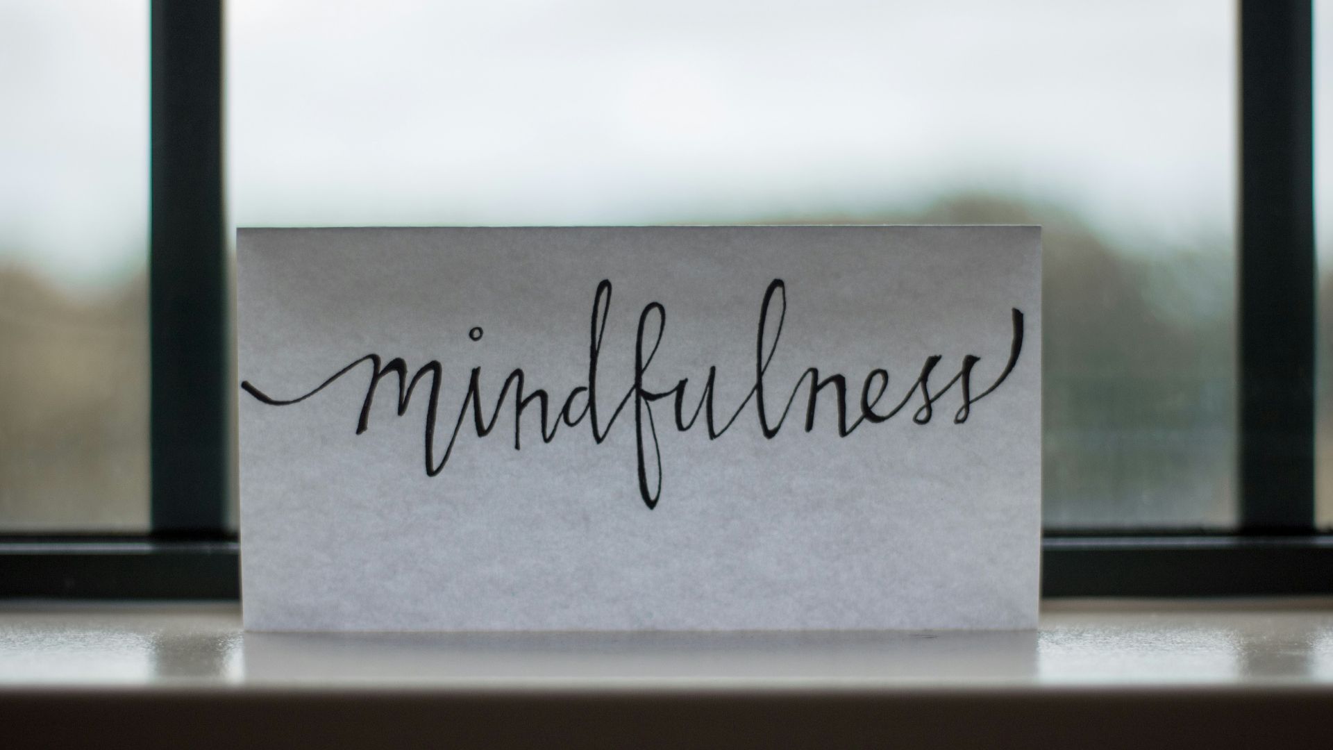 mindfulness printed paper near window