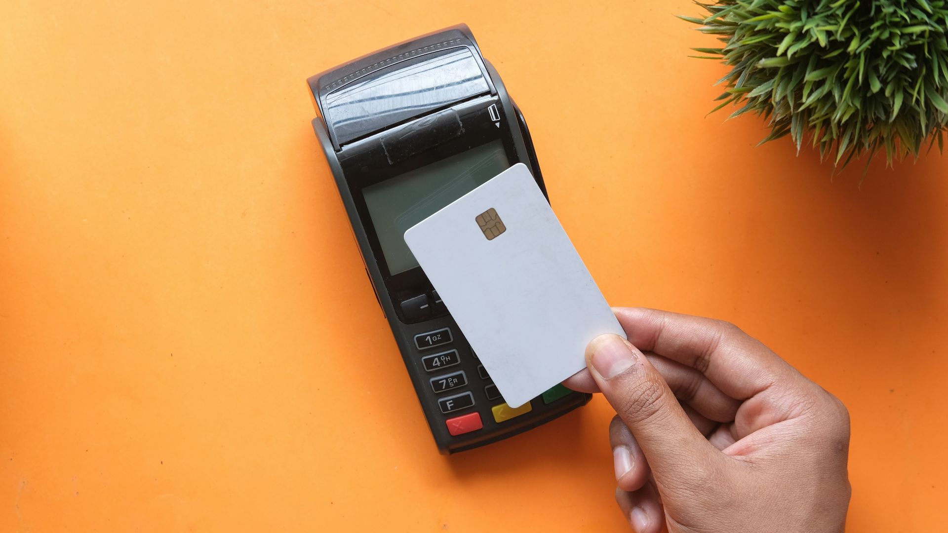 person holding black and white electronic device