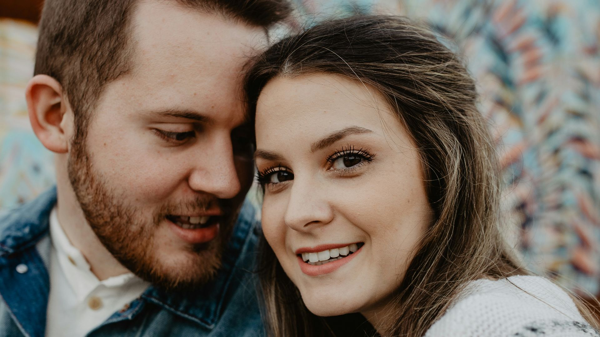 woman and man wearing white sweater