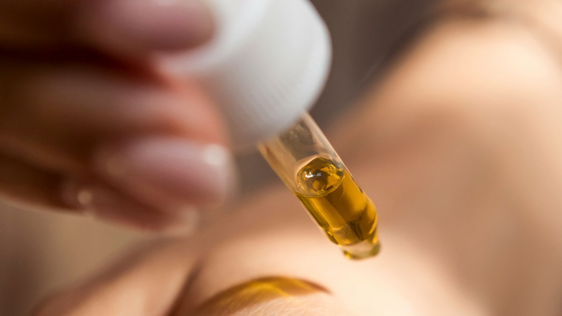 person holding dropper