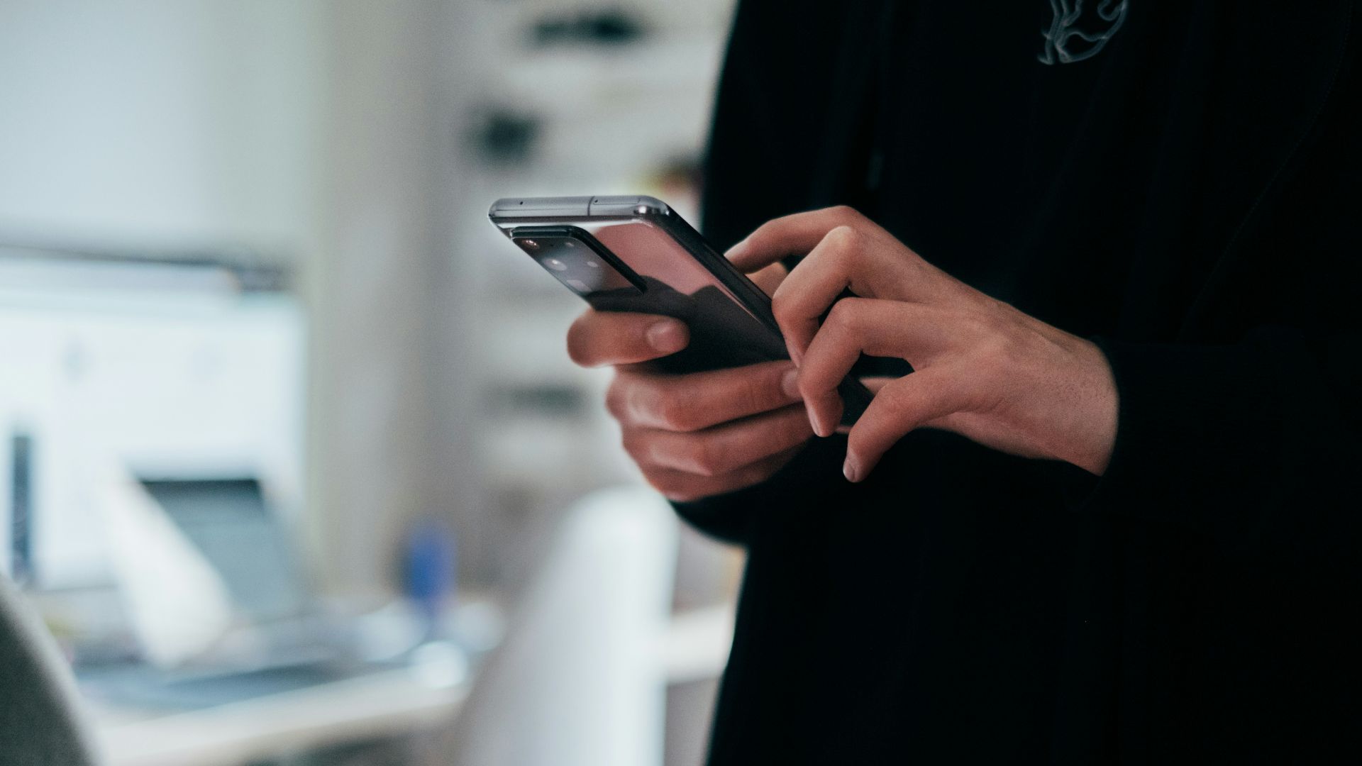 person holding black android smartphone