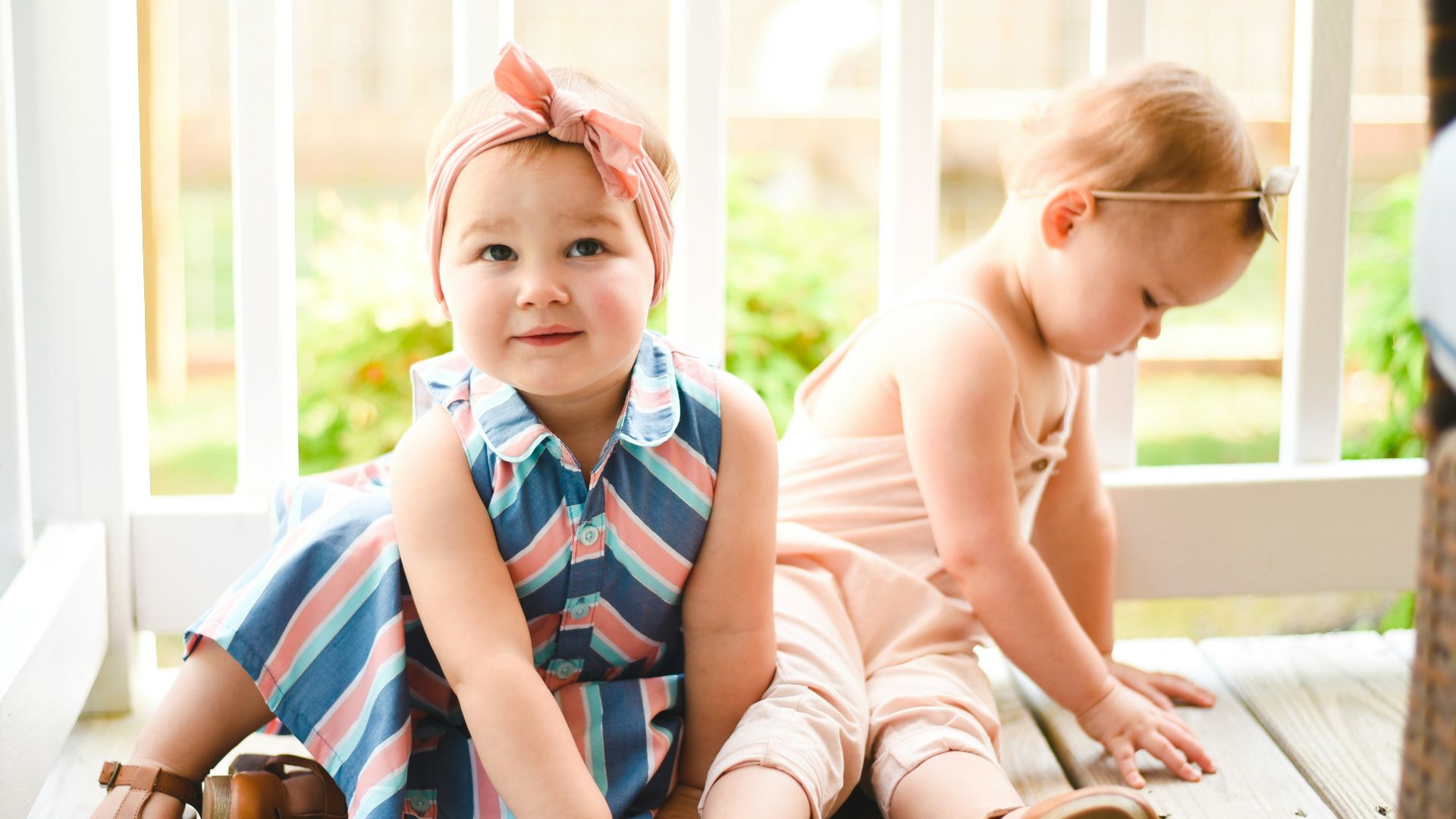 two babies on porch