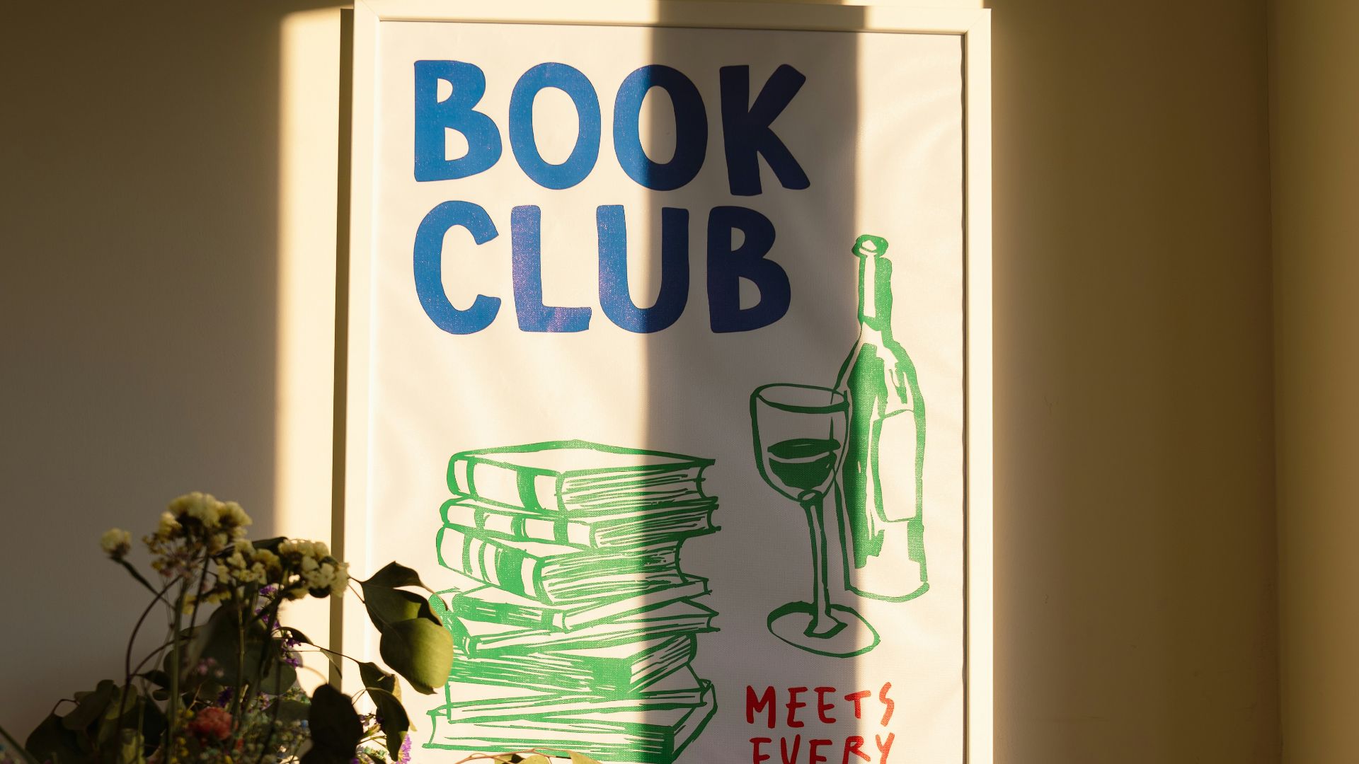 A wooden table topped with a vase of flowers