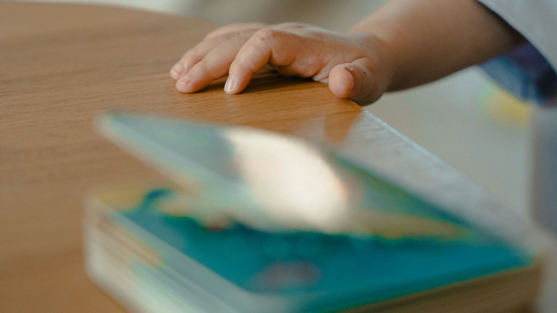 a hand holding a tablet