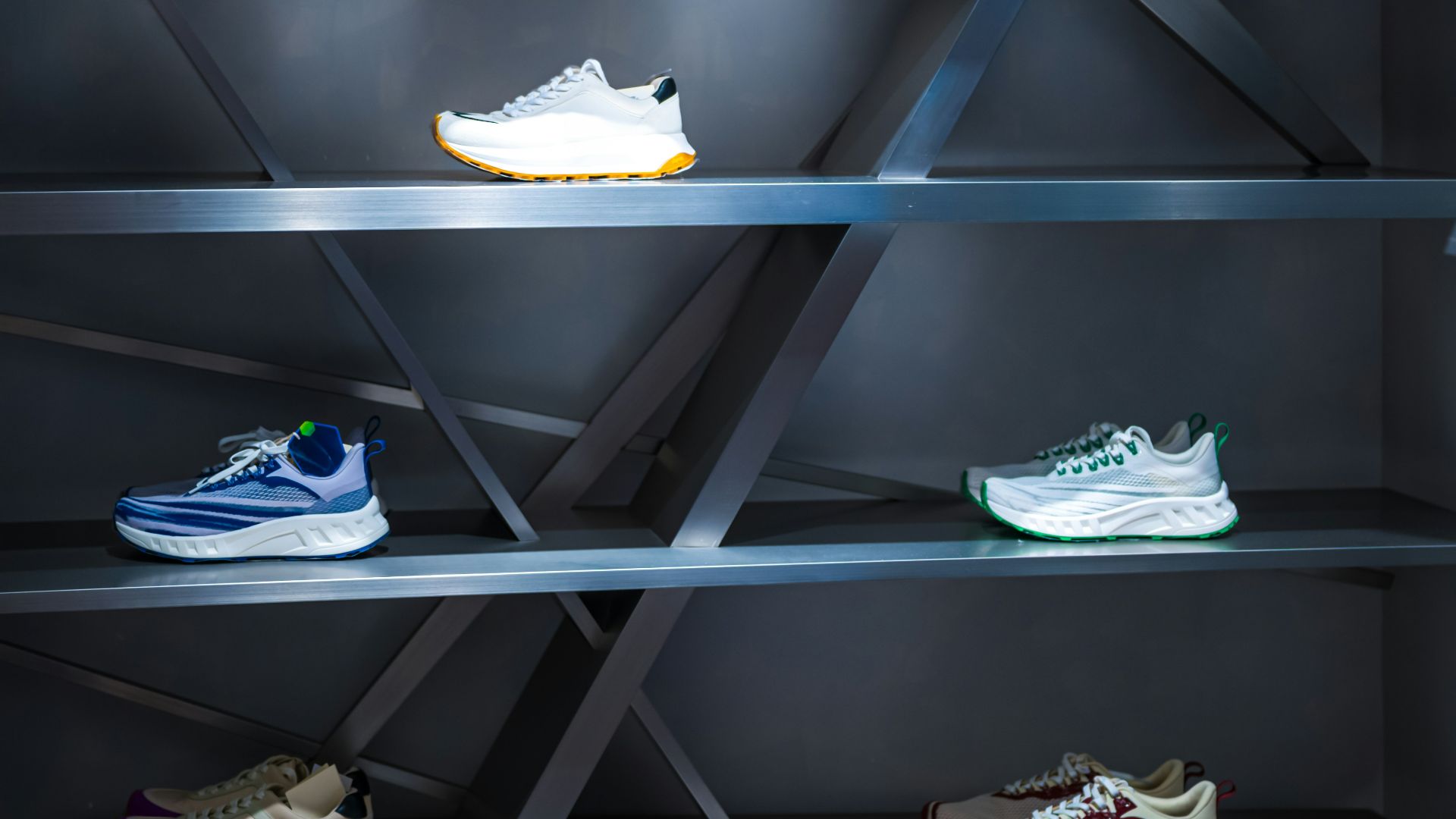 A display case with a bunch of shoes on it