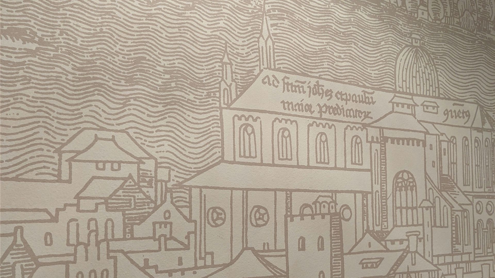 a wall with a drawing of a city on it