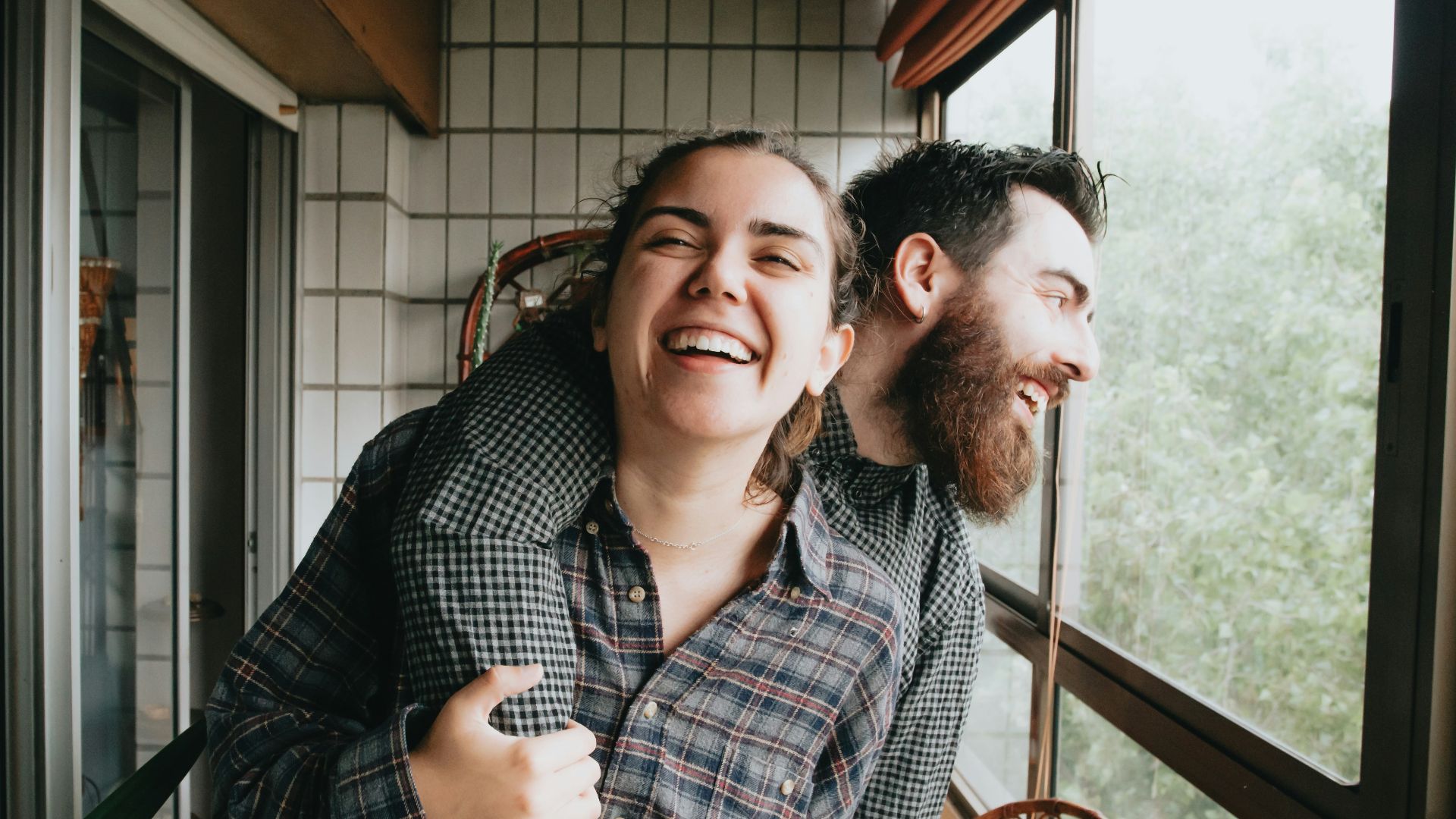 man and woman sitting on chair