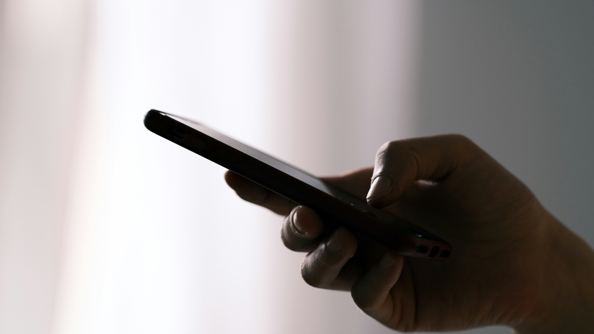 person holding black android smartphone