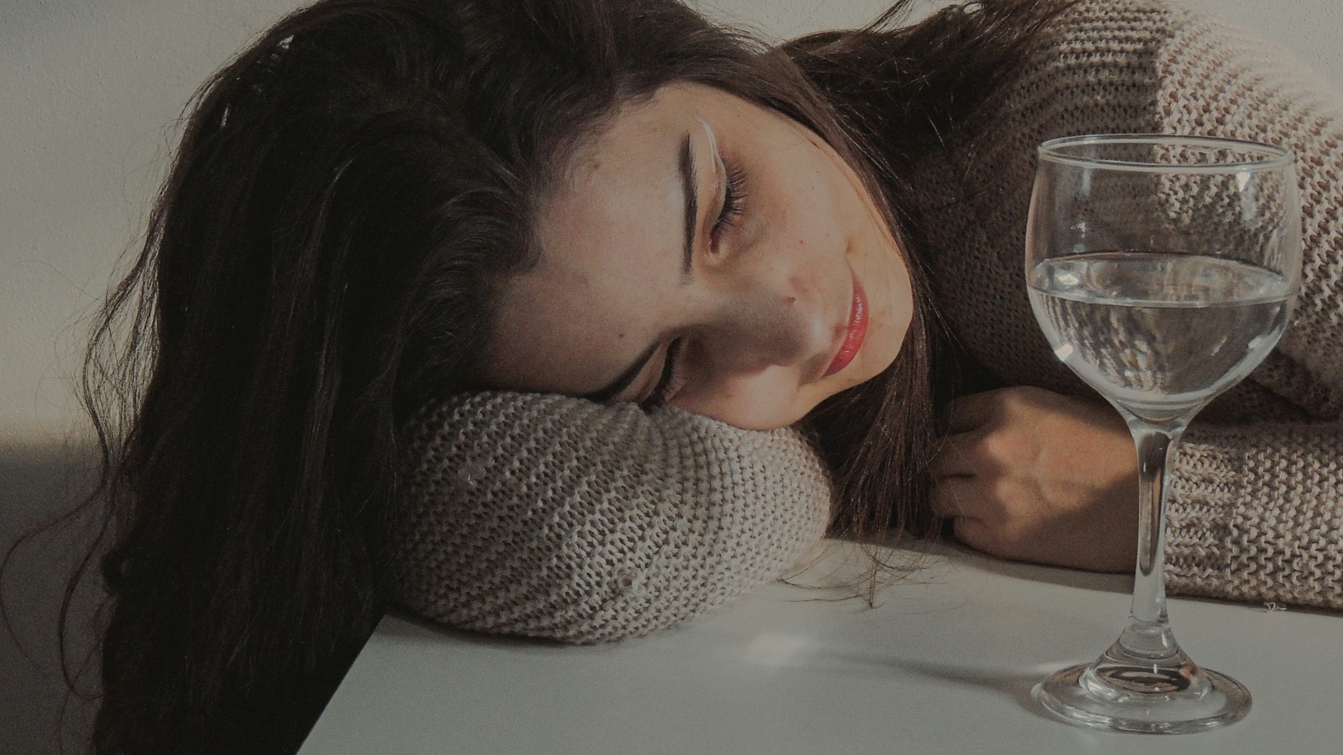 woman in gray knit cap and gray knit cap