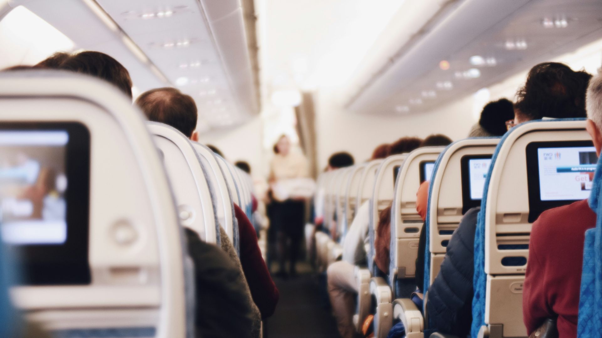 shallow focus photography of people inside of passenger plane