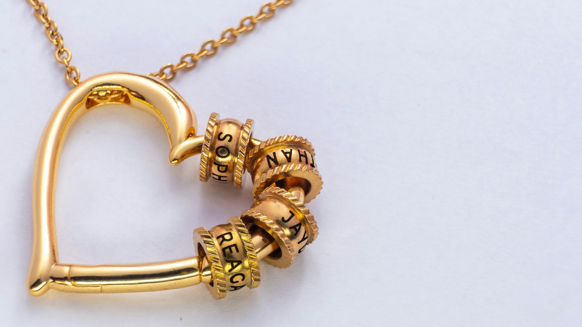 Gold heart pendant necklace with charm beads