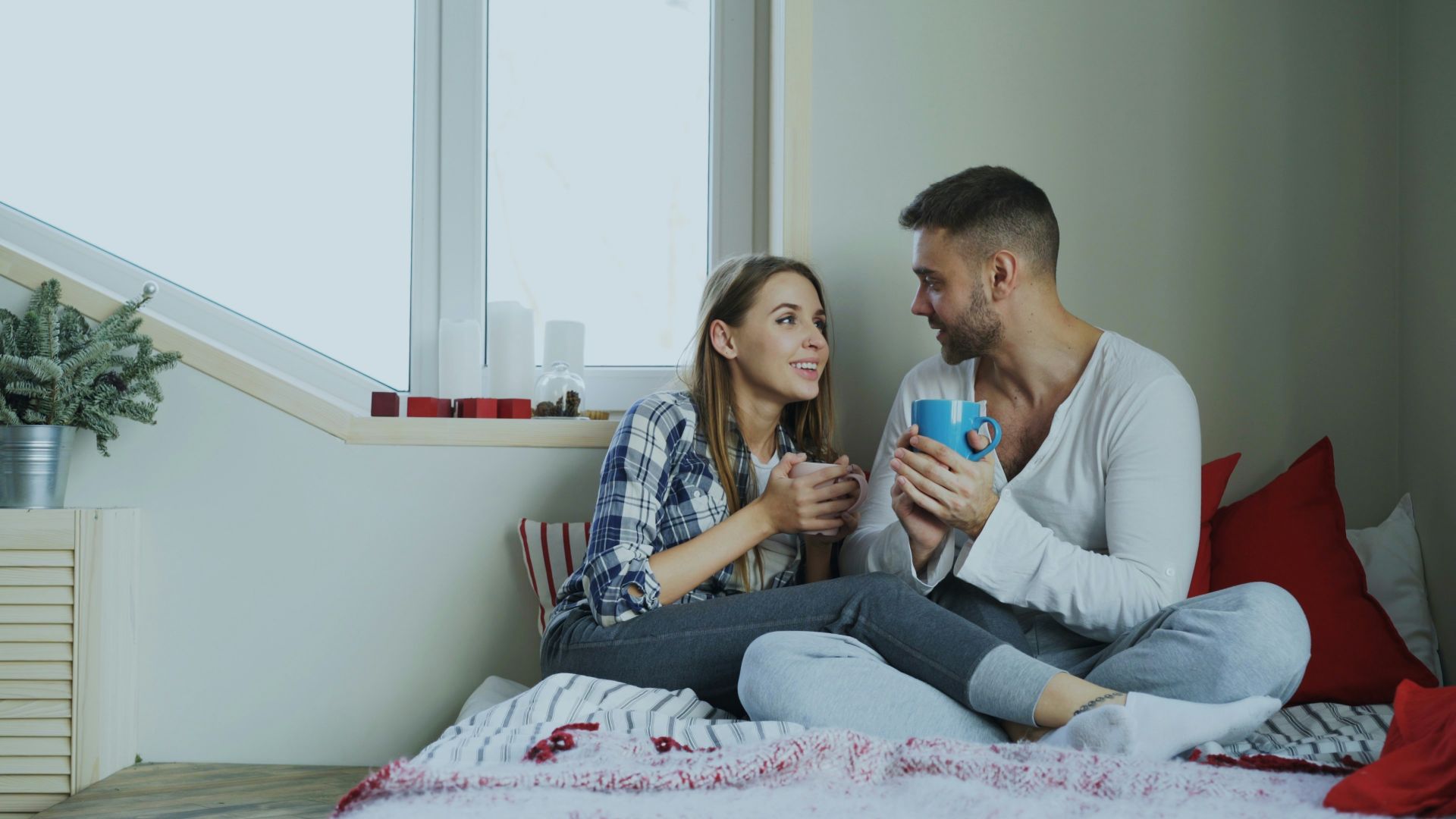 Couple enjoying drinks by the window