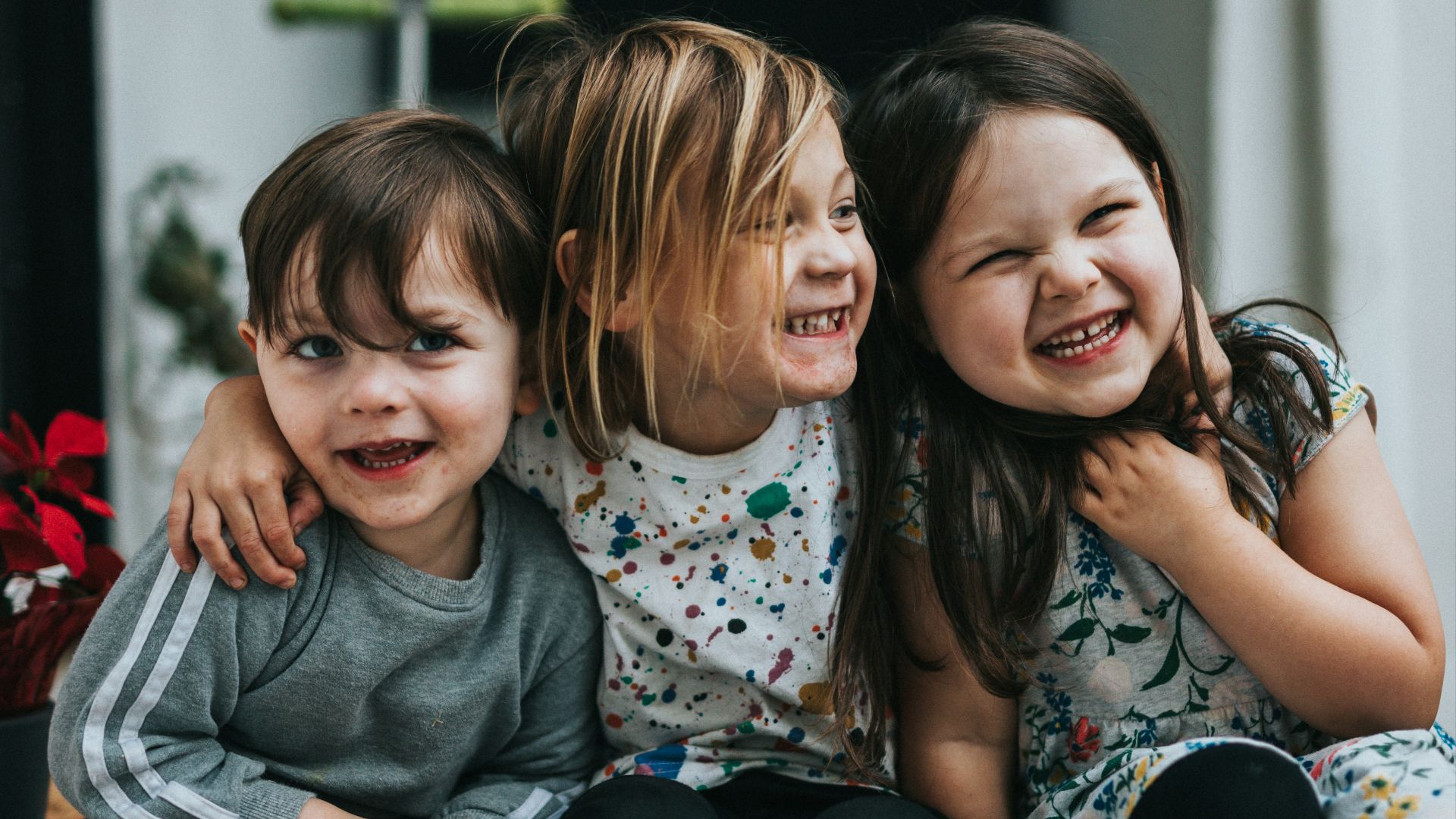 2 girls sitting on floor