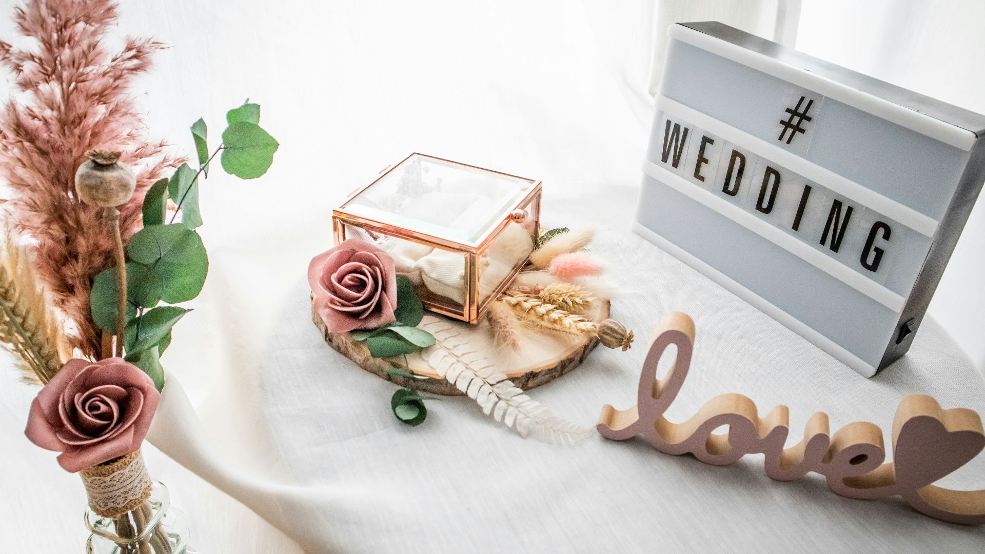 a table topped with a vase filled with flowers