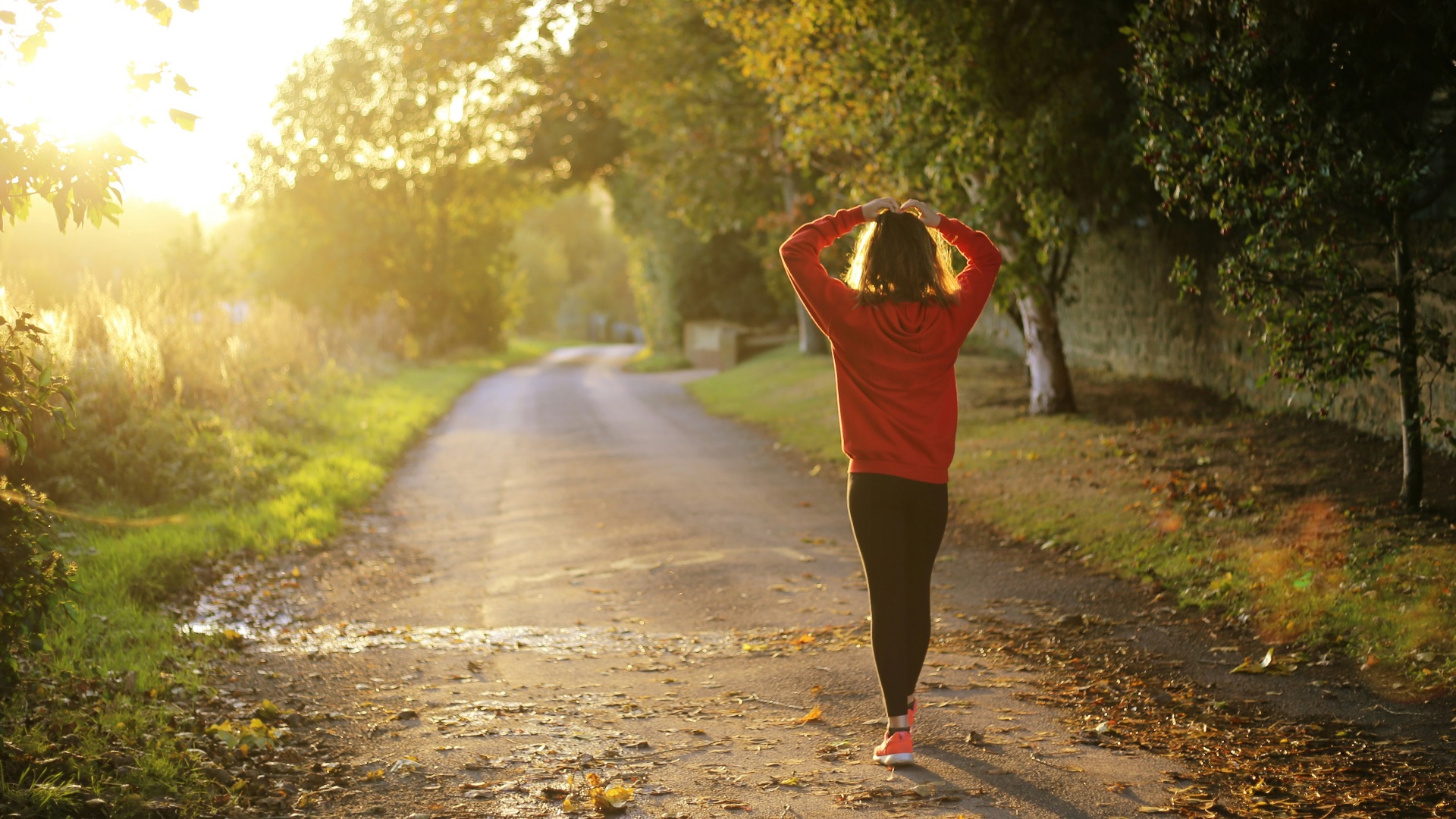 woman walking on pathway during daytime