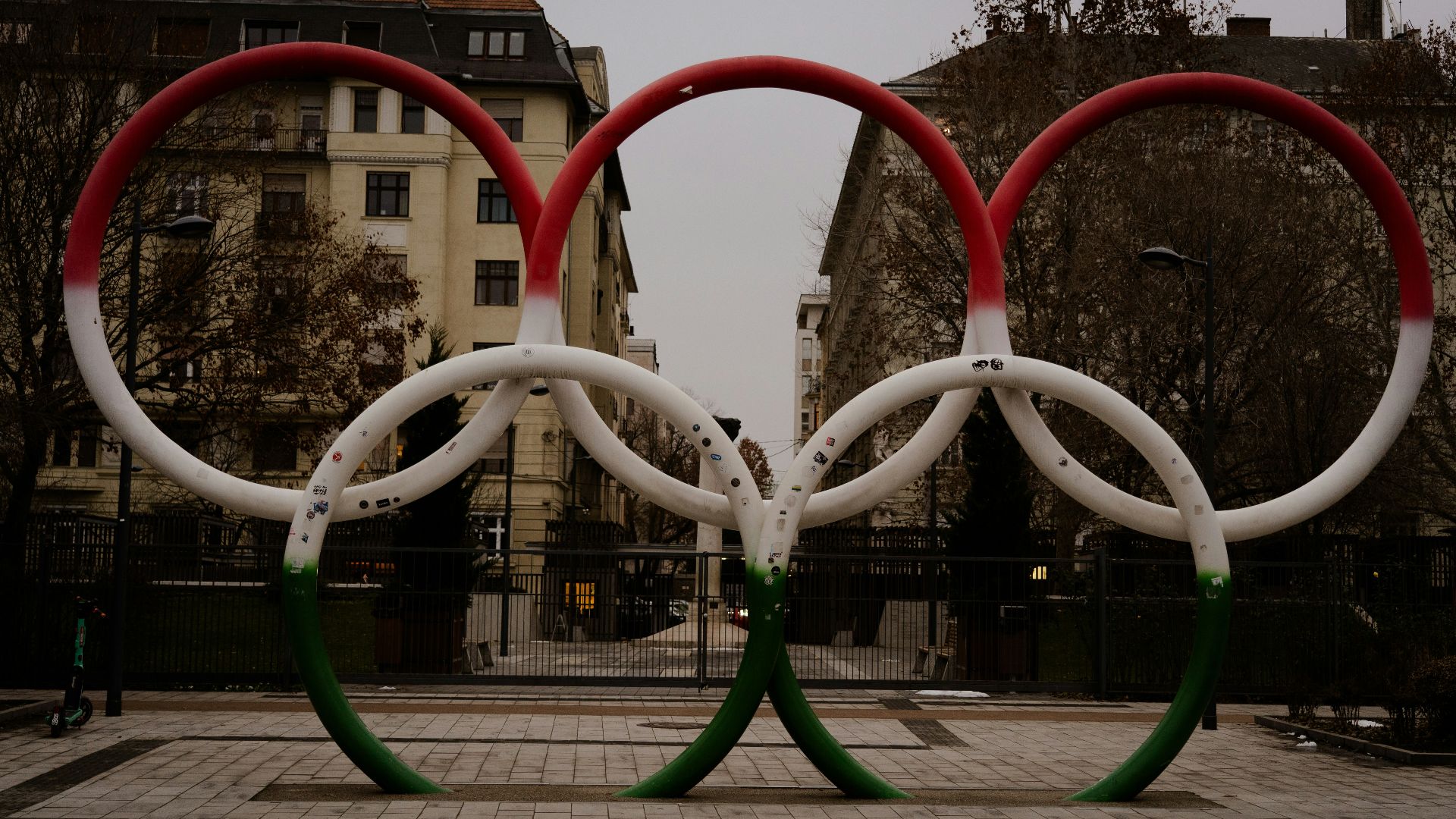 A couple of red and white rings sitting on top of a sidewalk