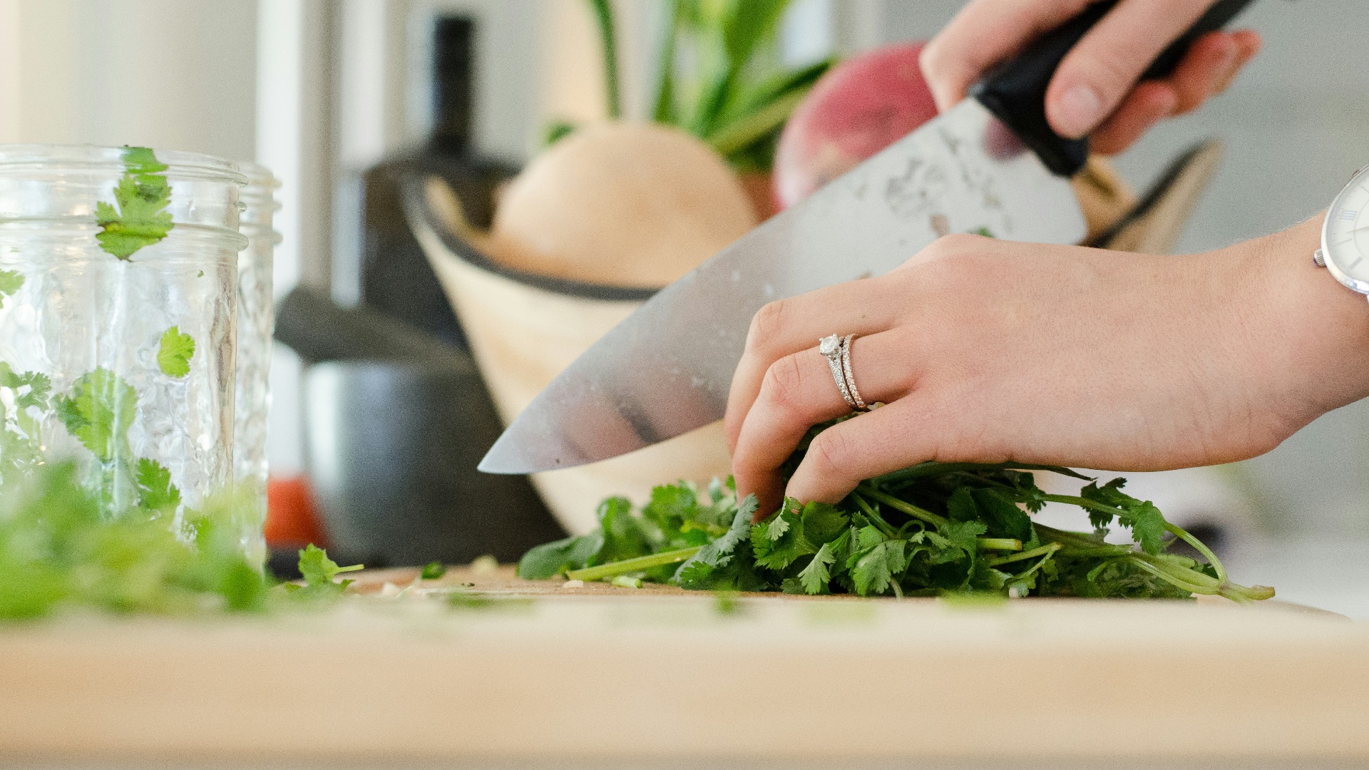 person cutting vegetables with knife