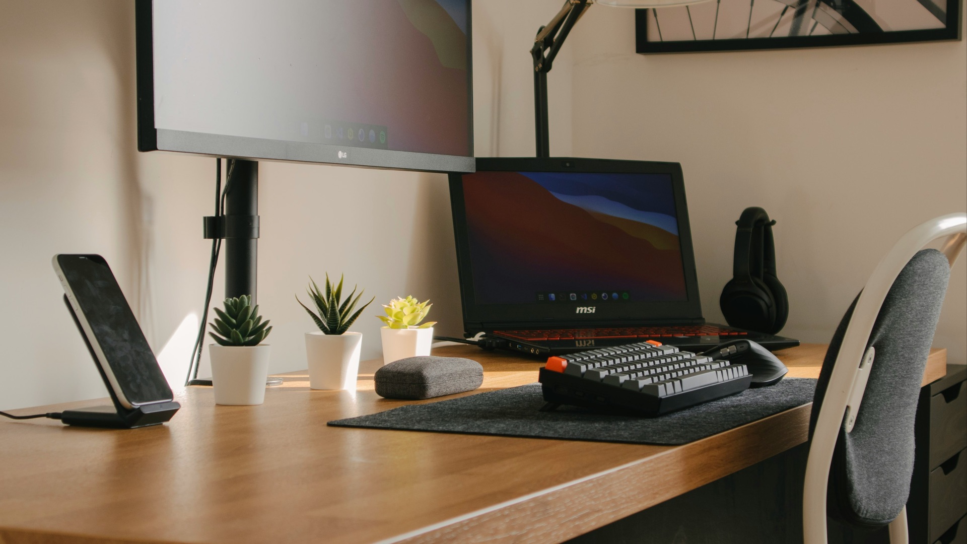 black flat screen computer monitor on brown wooden table
