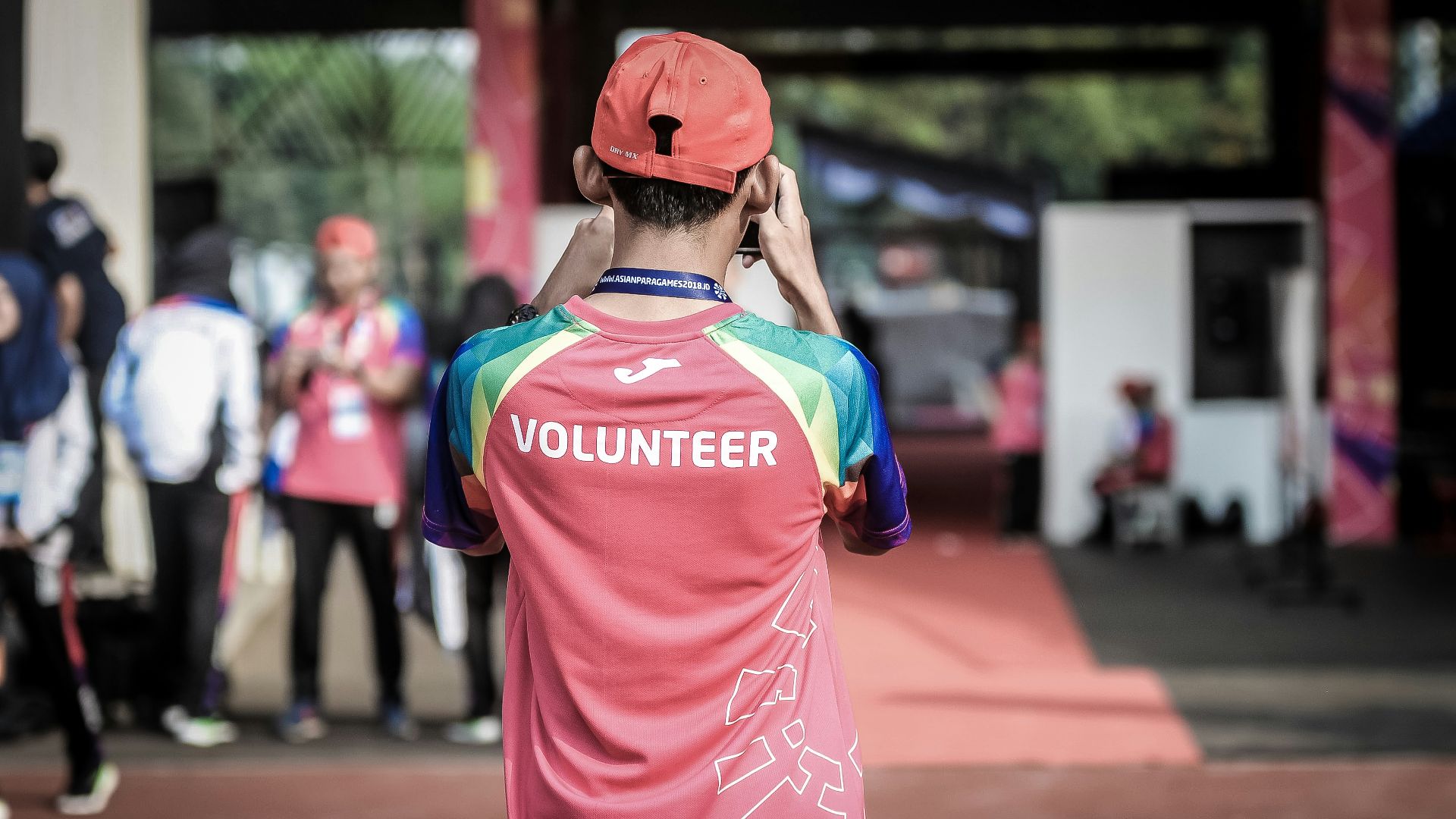 person standing wearing red shirt