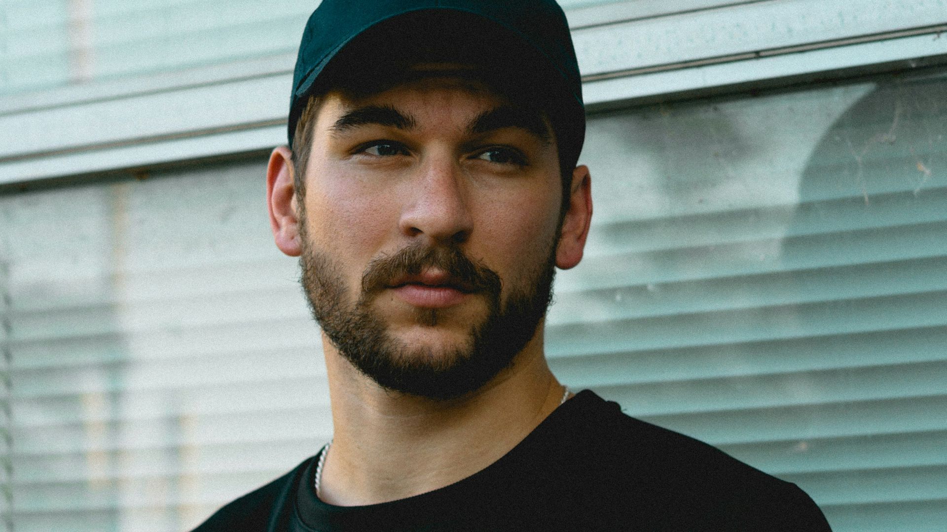 man standing in front of window