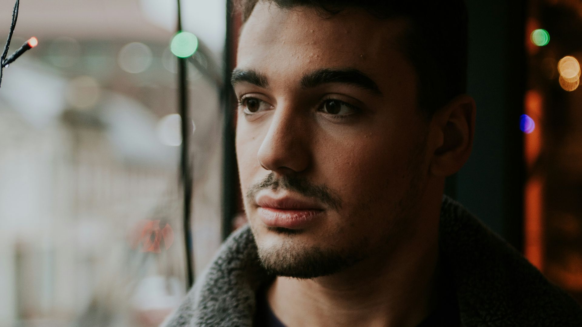 man in brown zip-up jacket
