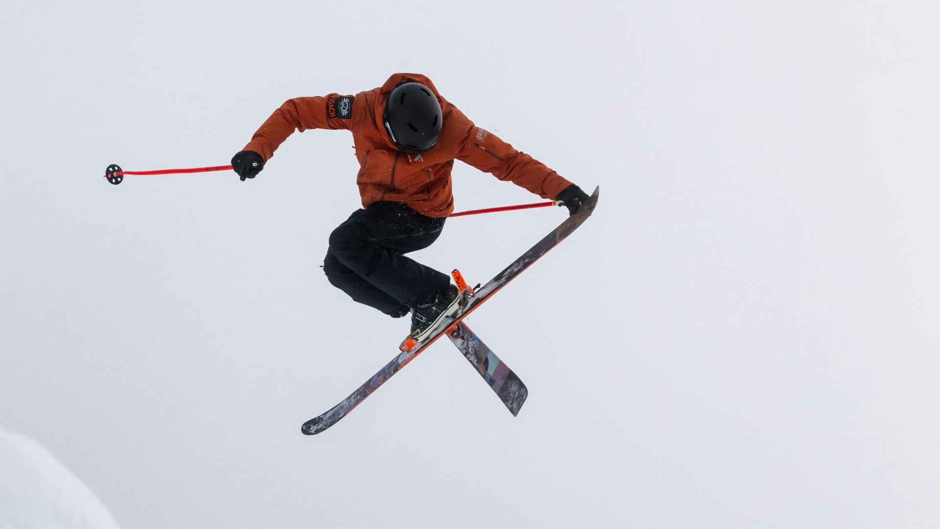 a man flying through the air while riding skis
