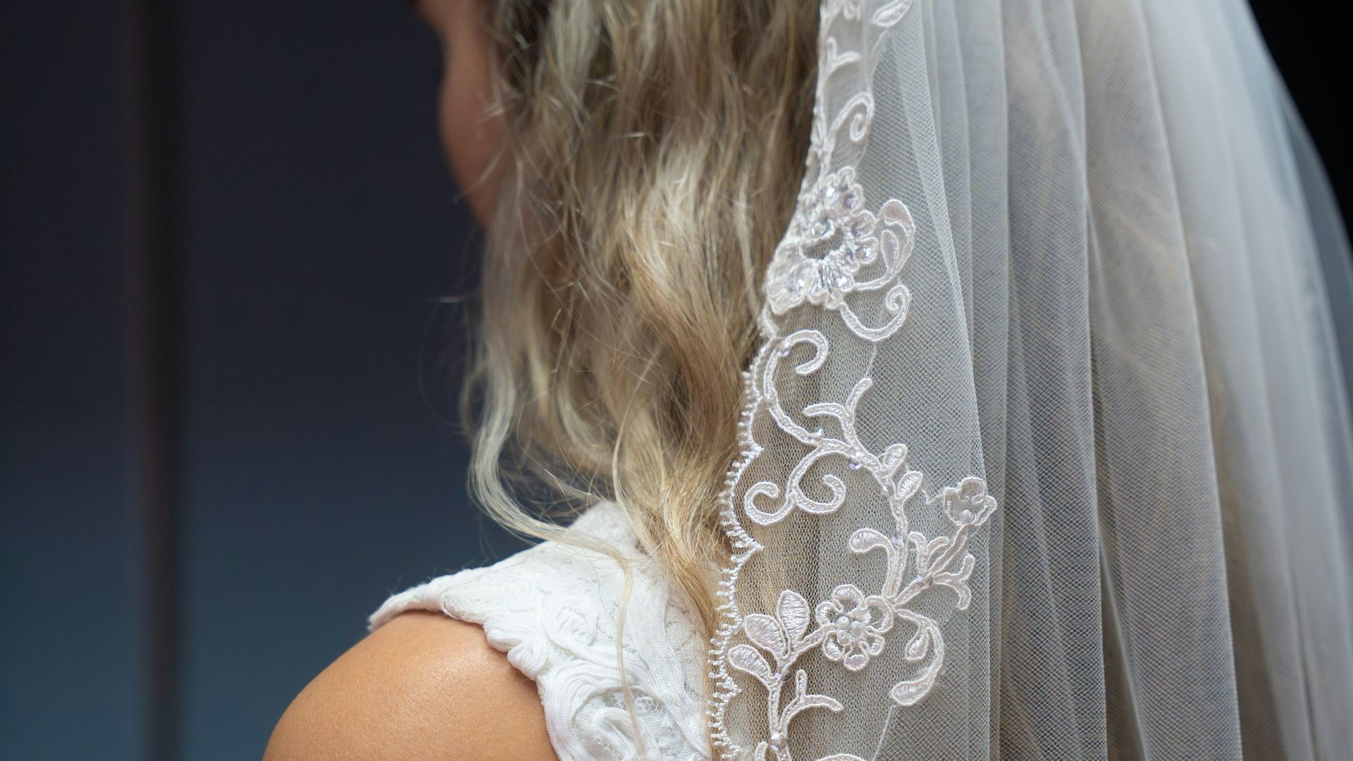 Bride wearing a white veil and dress
