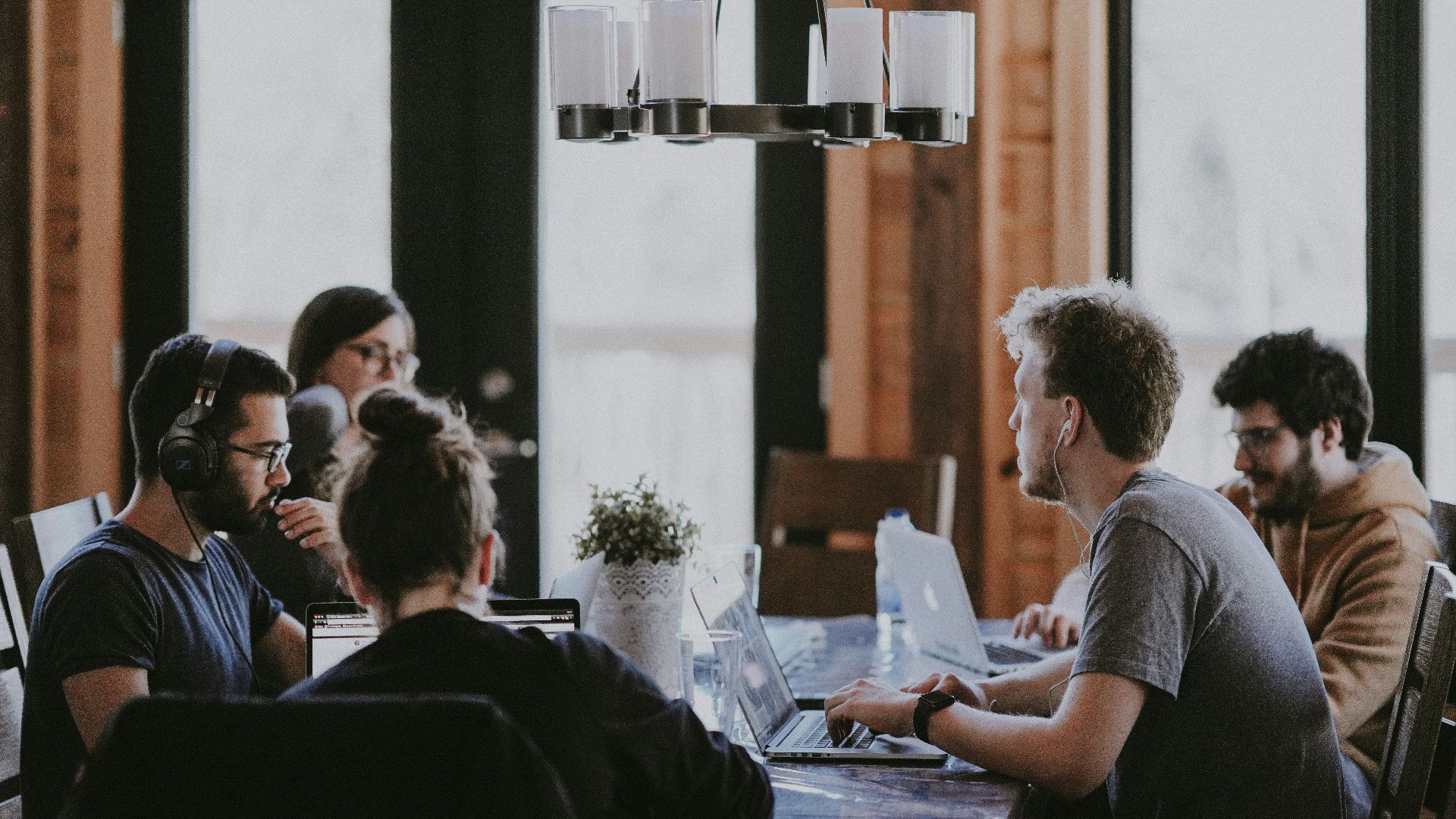 sittin people beside table inside room