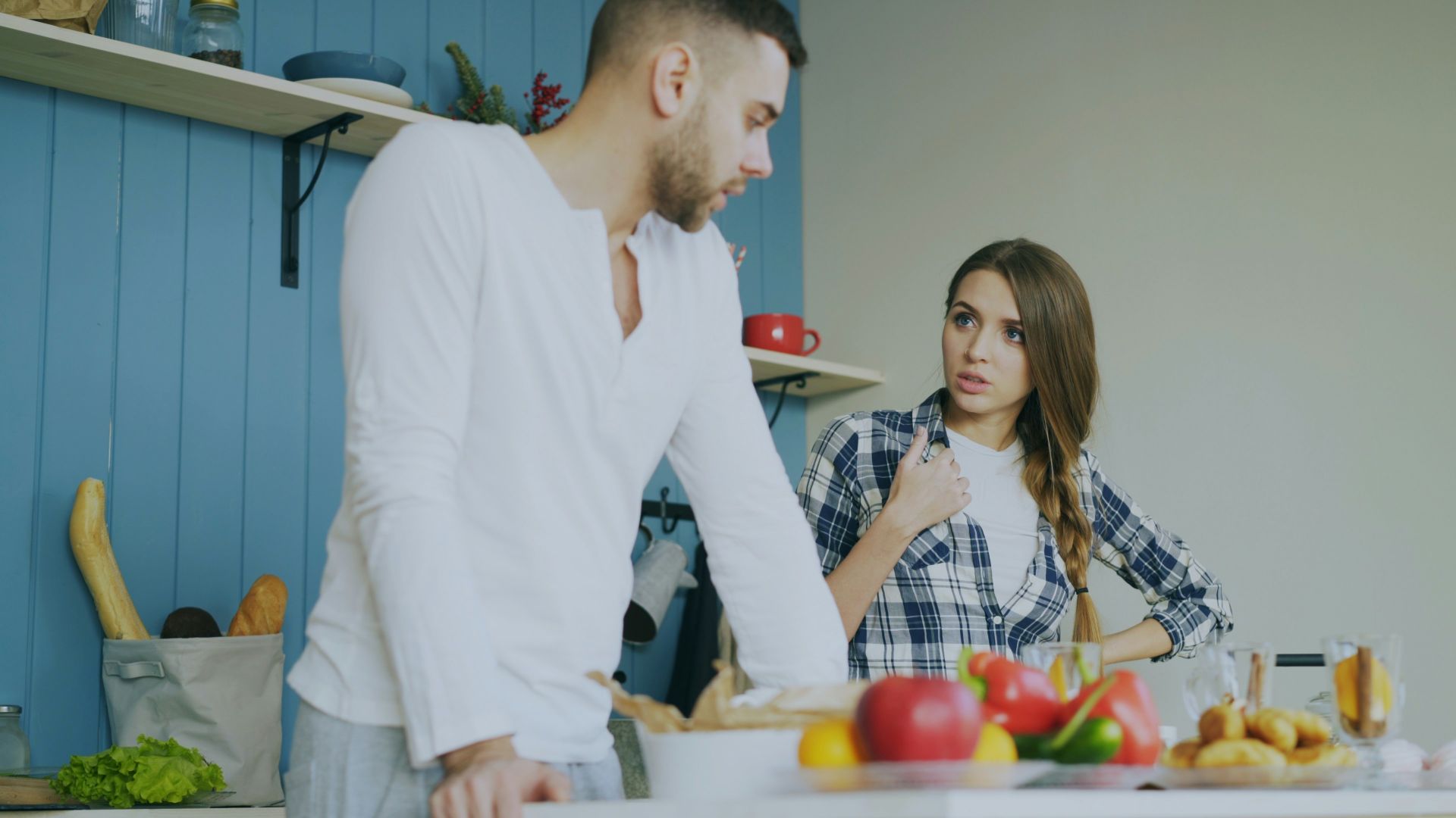 Couple arguing in a kitchen