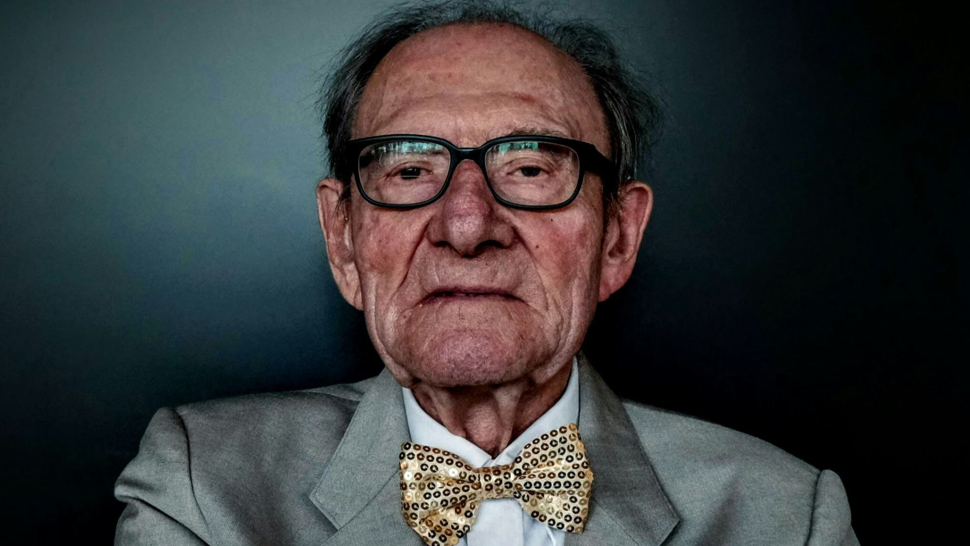 man wearing grey blazer