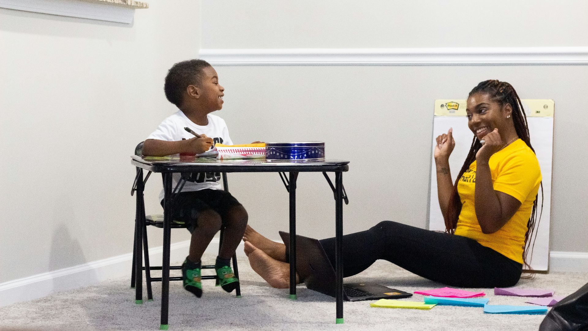 woman in black dress sitting on chair