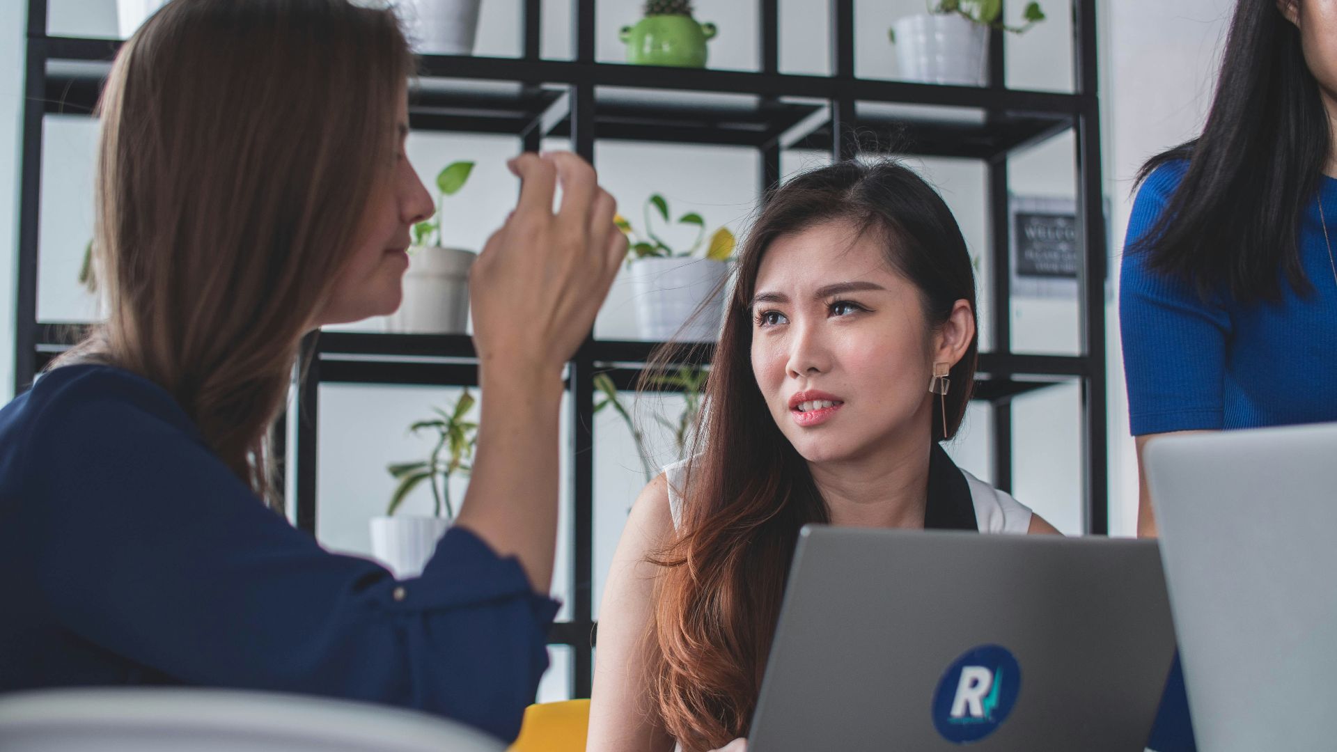 woman sitting in front of laptop